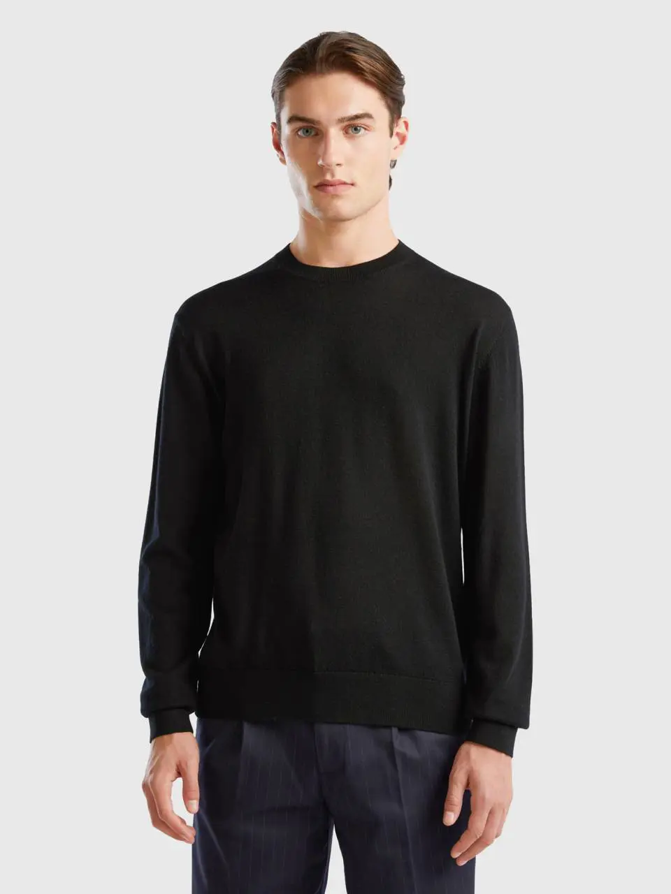 Benetton black sweater in pure merino wool. 1