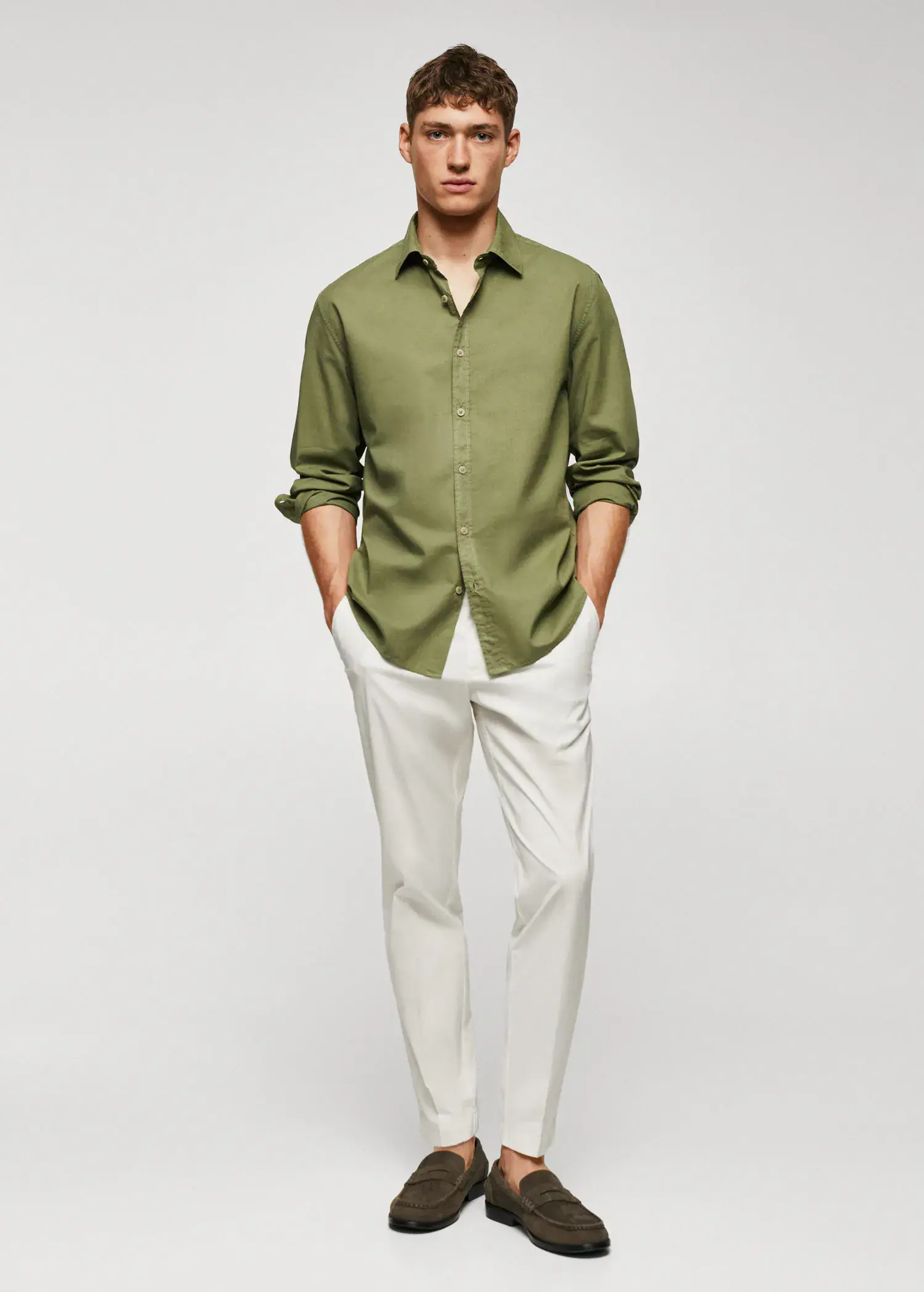 Mango Regular-fit cotton voile shirt. a man wearing a green shirt and white pants. 