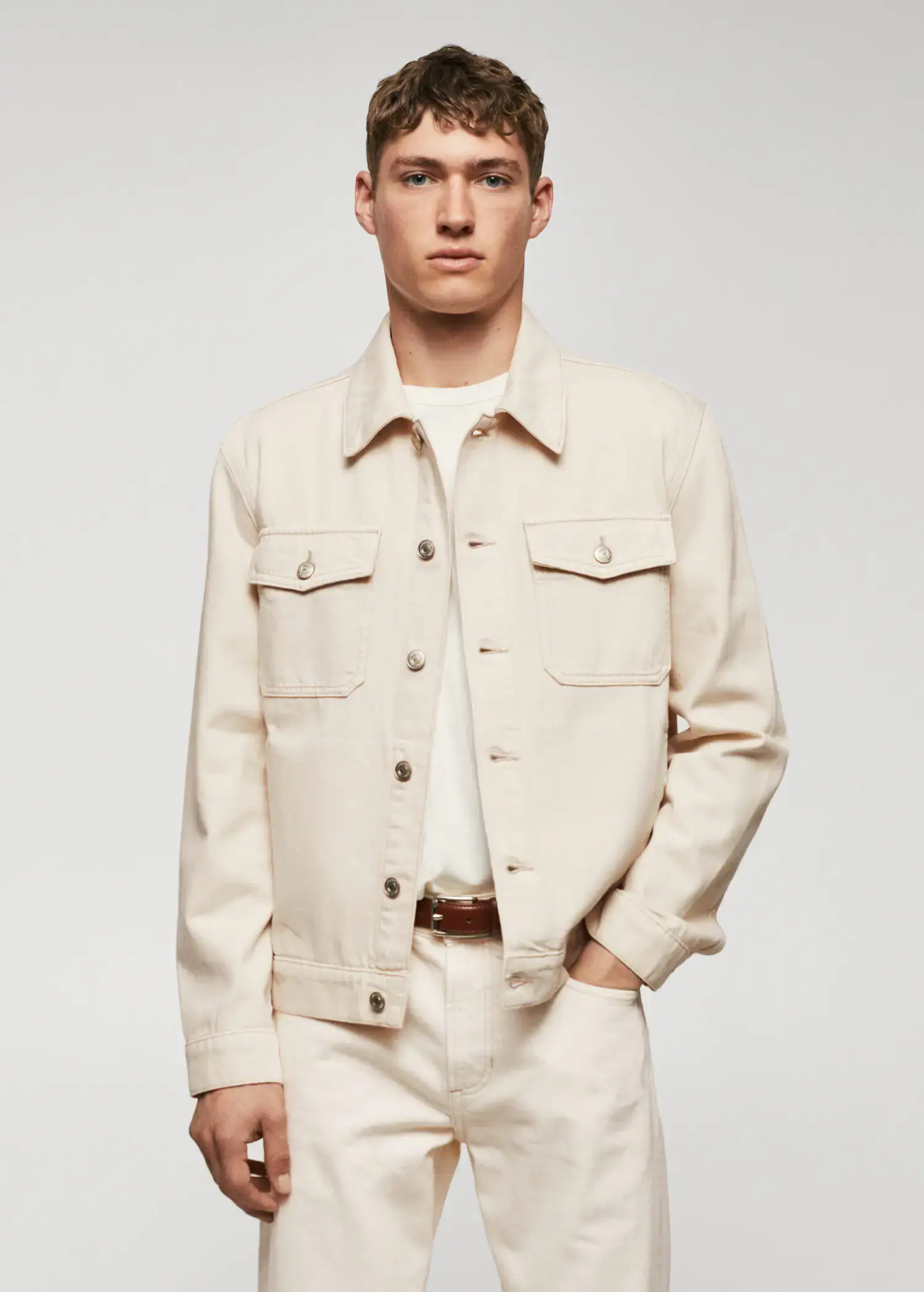 Mango Pocketed denim jacket. a man in a white shirt and jacket. 