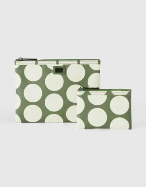 two green bags with white polka dots