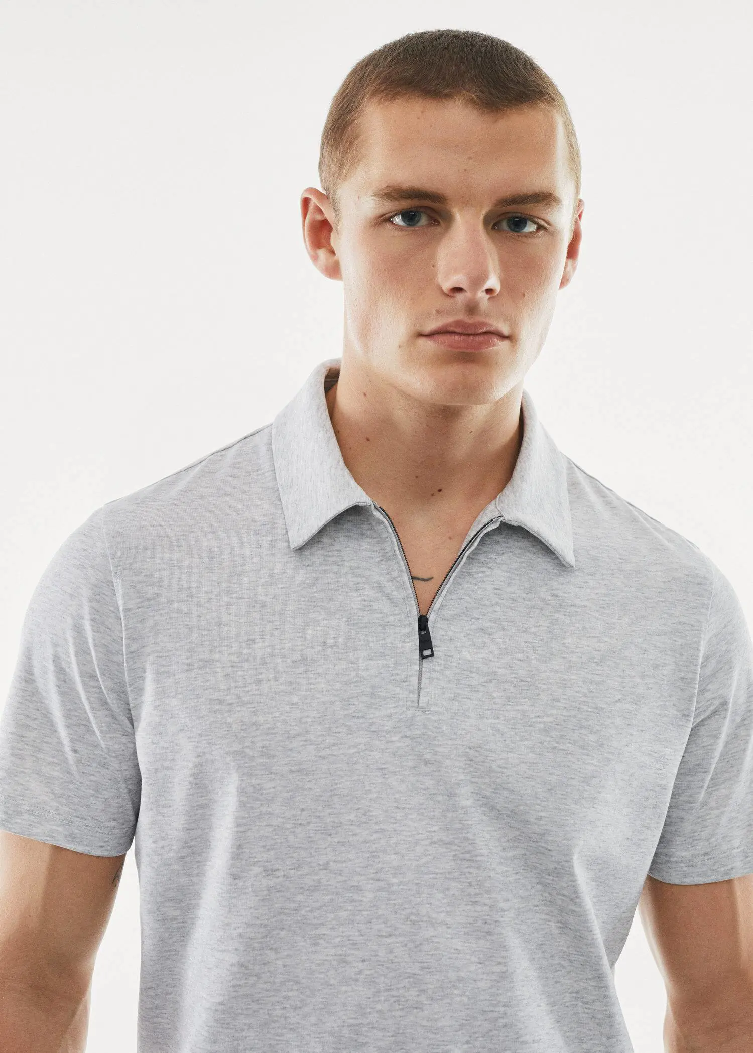 Mango Zip cotton polo shirt. a young man wearing a gray polo shirt. 