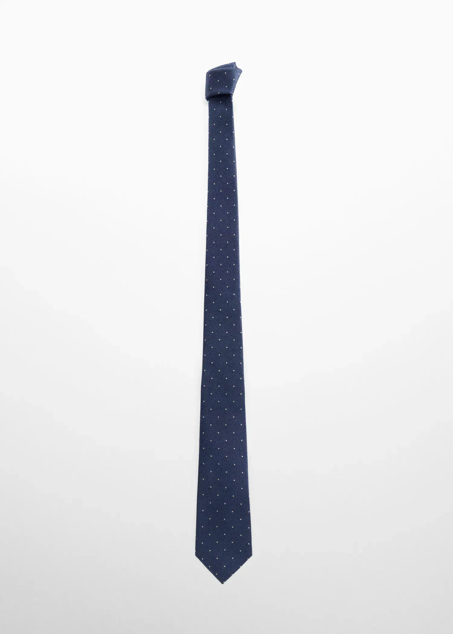 Mango Tie with micro polka-dot structure. a long blue tie is hanging on a pole. 