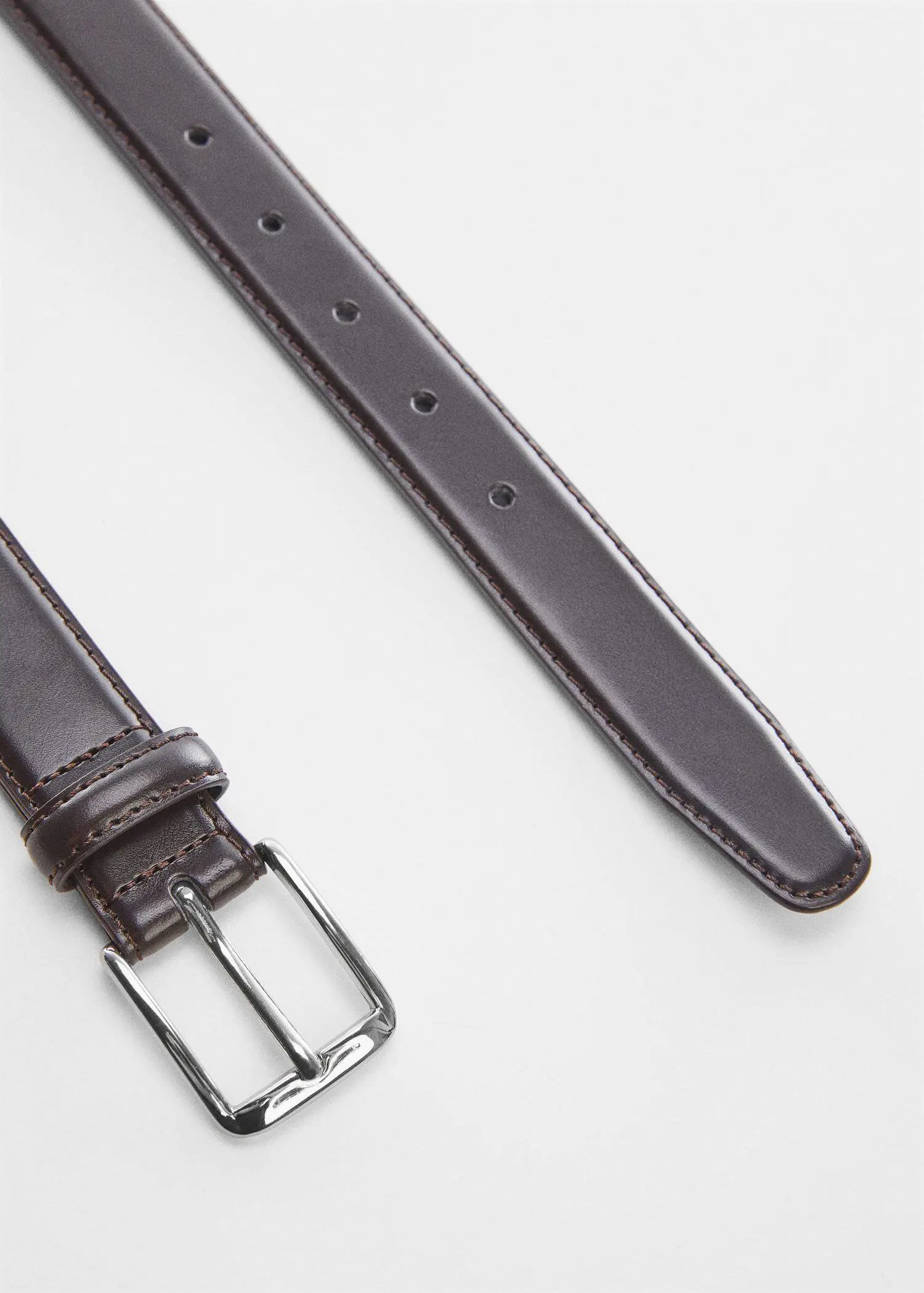Mango Leather belt. a close-up of a brown leather belt. 