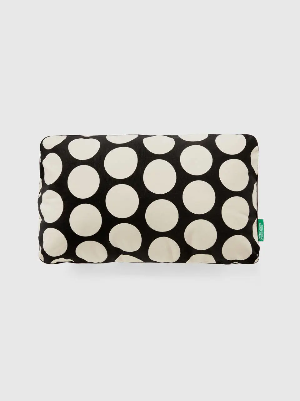 Benetton rectangular pillow with white polka dots. 1