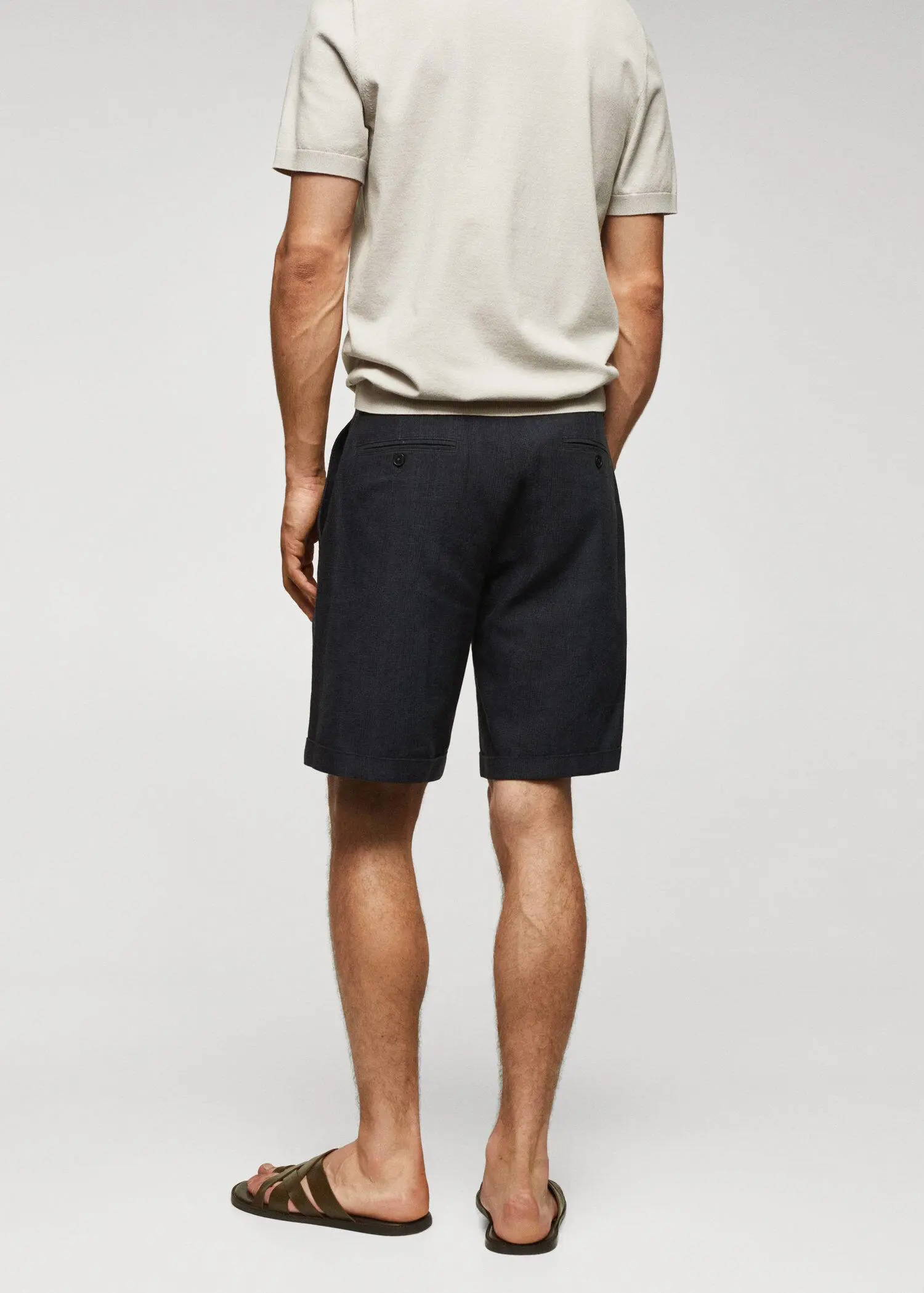 Mango Prince of Wales printed cotton-linen bermuda shorts. a man in black shorts and a white shirt. 