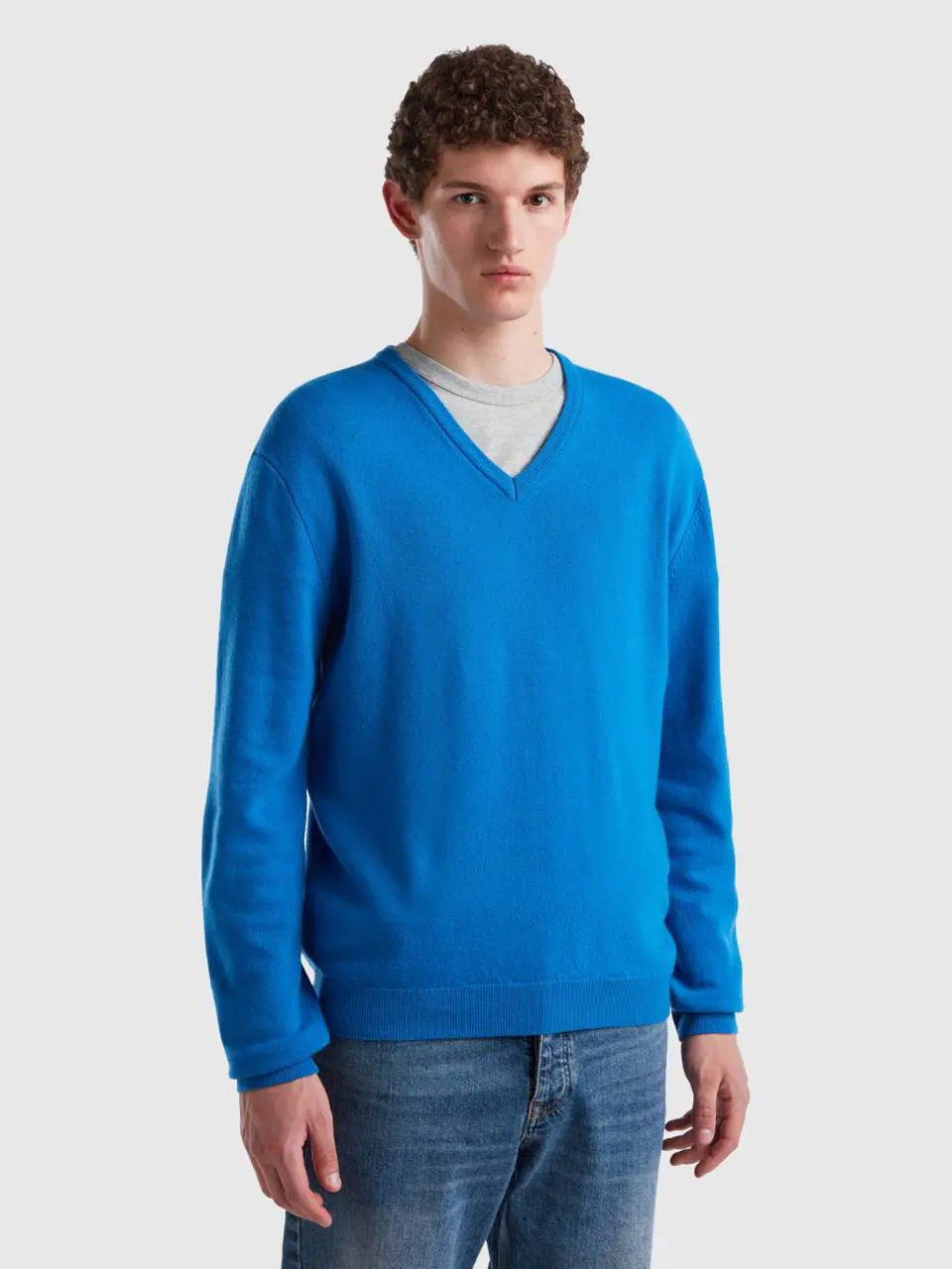 Benetton cornflower blue v-neck sweater in pure merino wool. 1