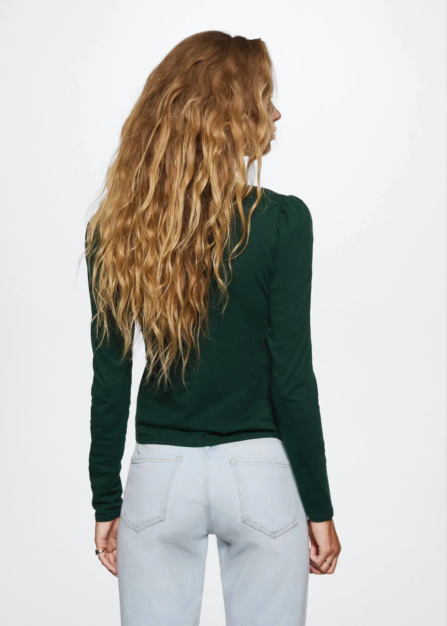Mango Long-sleeved V-neck T-shirt. the back view of a woman with long blonde hair. 