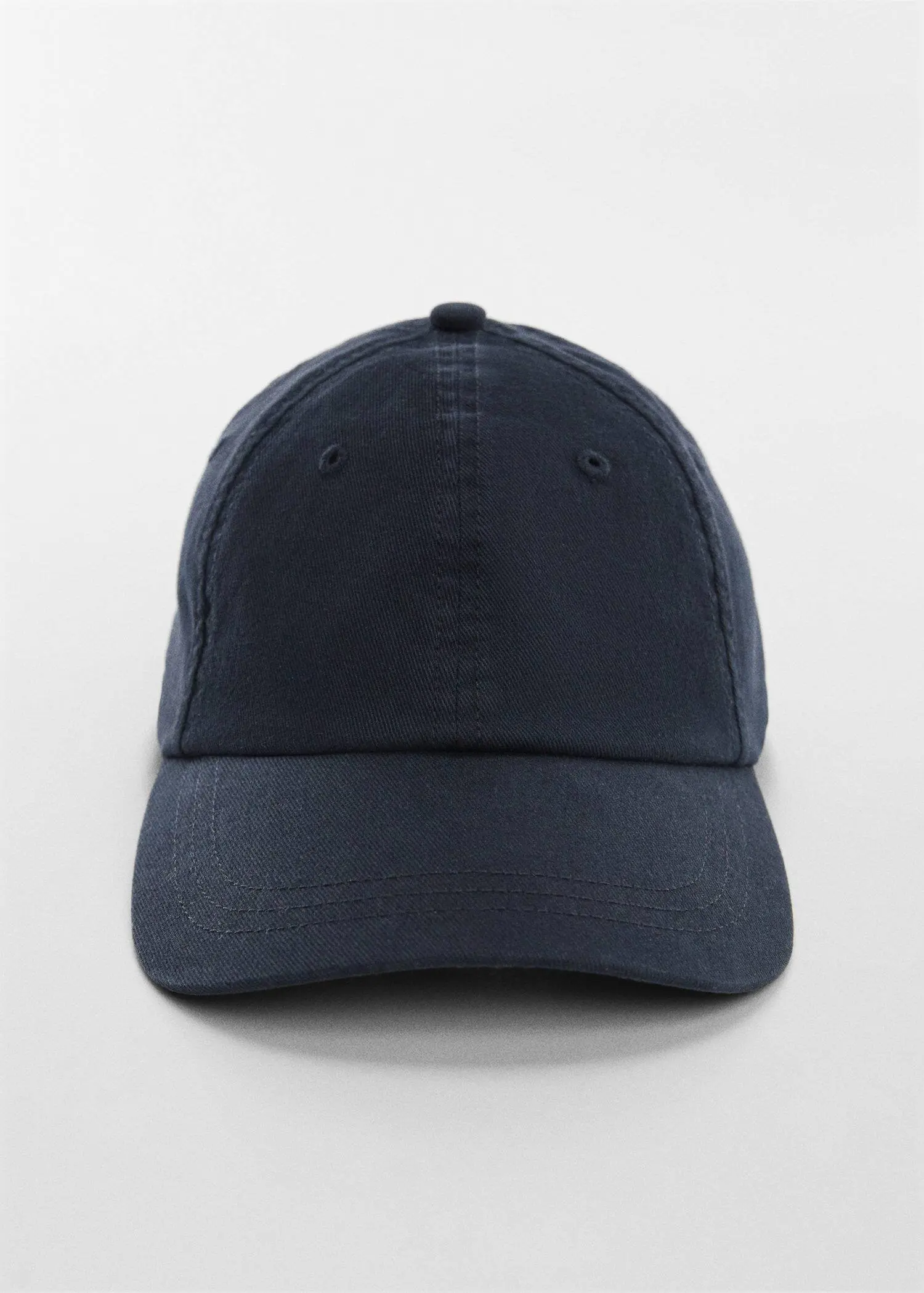 Mango Organic cotton cap. a baseball cap is shown on top of a white surface. 