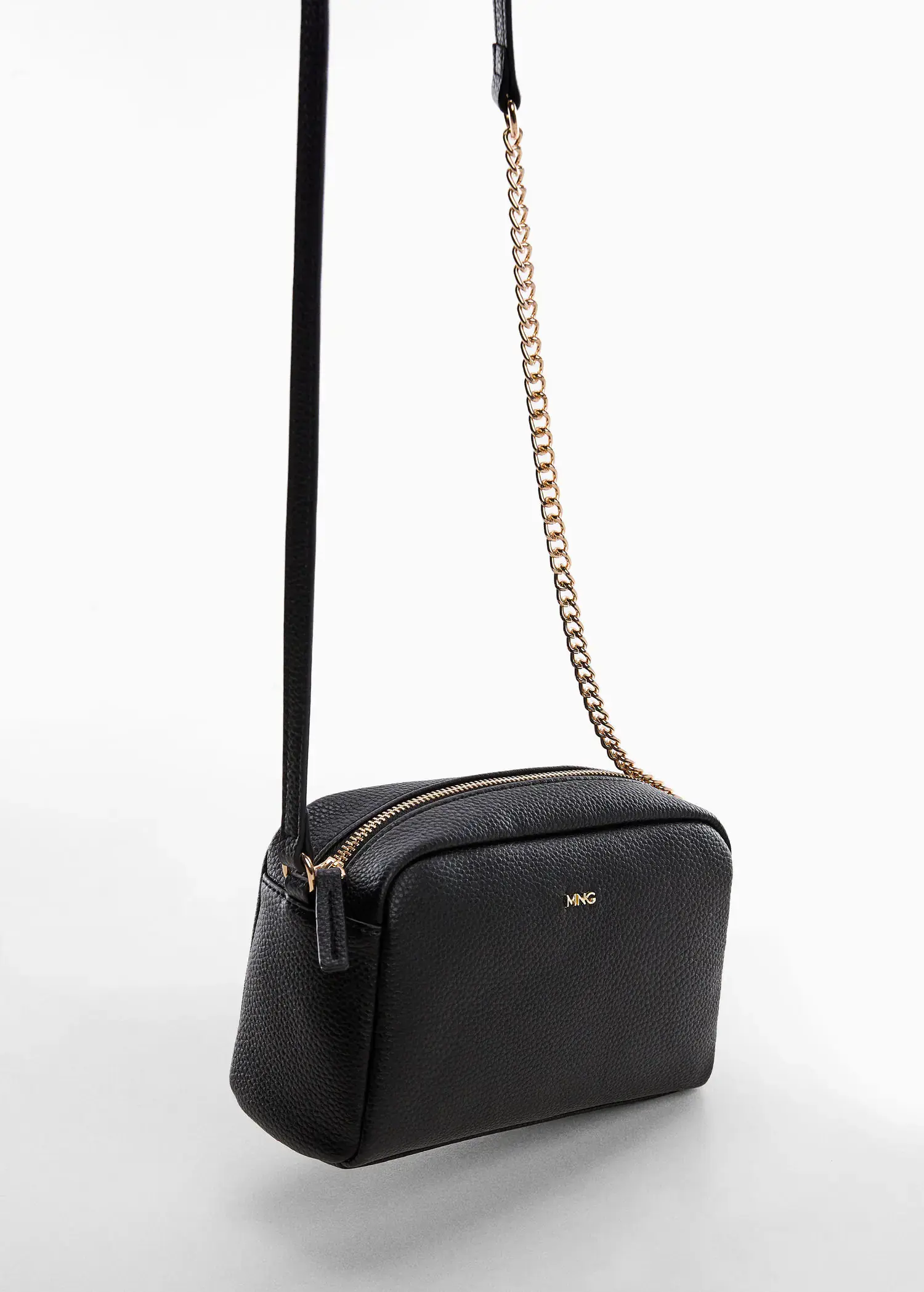 Mango Crossbody bag with chain. a black purse with a gold chain strap. 