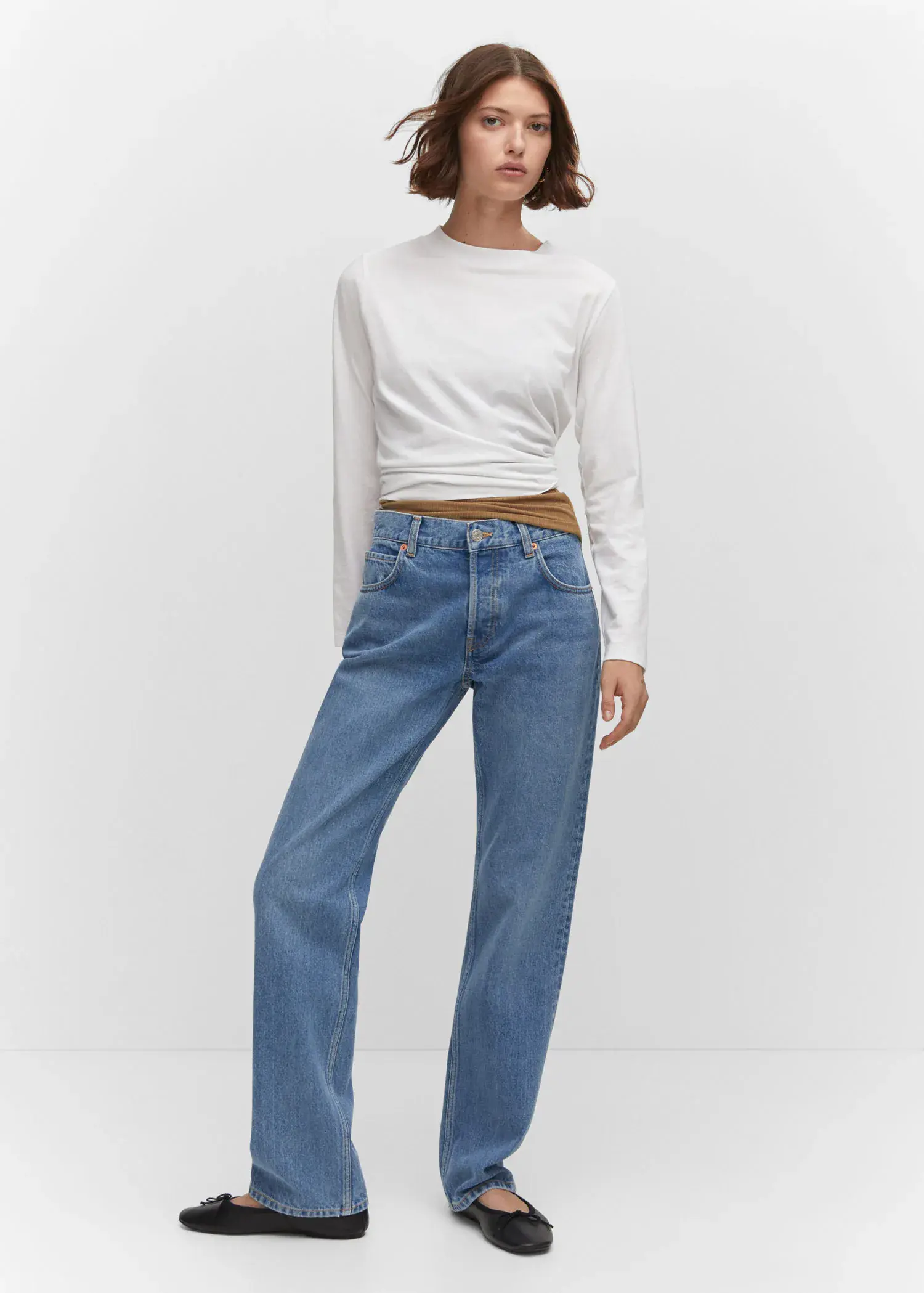 Mango Mid-rise straight jeans. a woman in a white shirt and blue jeans. 