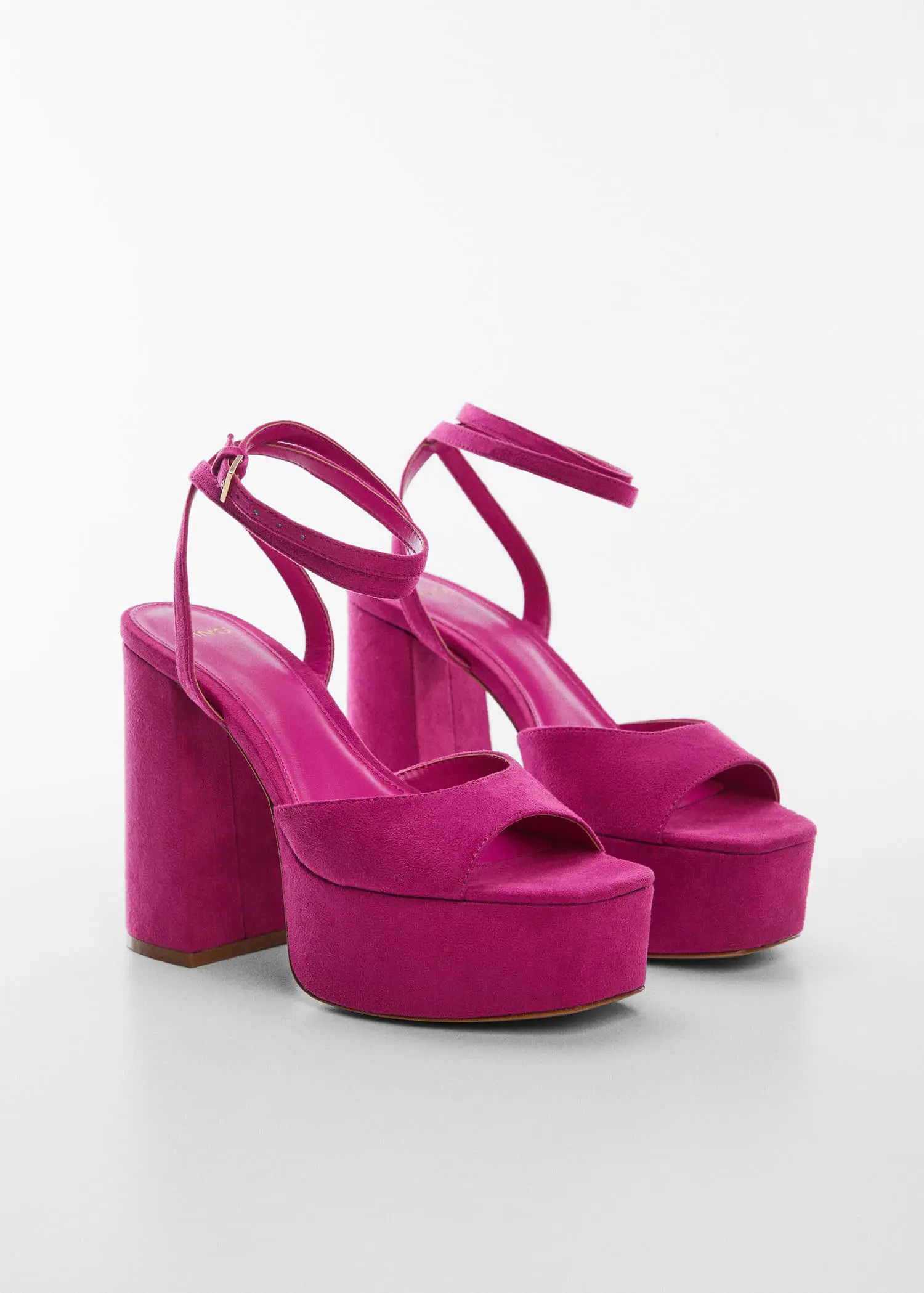 Mango Platform ankle-cuff sandals. a pair of pink high heel shoes on a white surface. 
