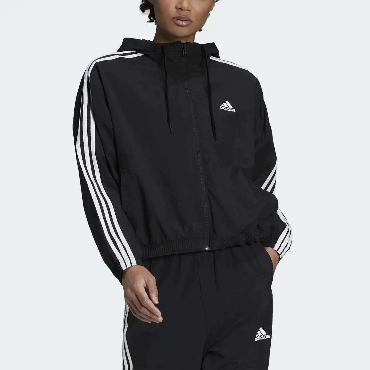 Adidas Essentials Repeat Logo Loose-Fit Windbreaker. 1