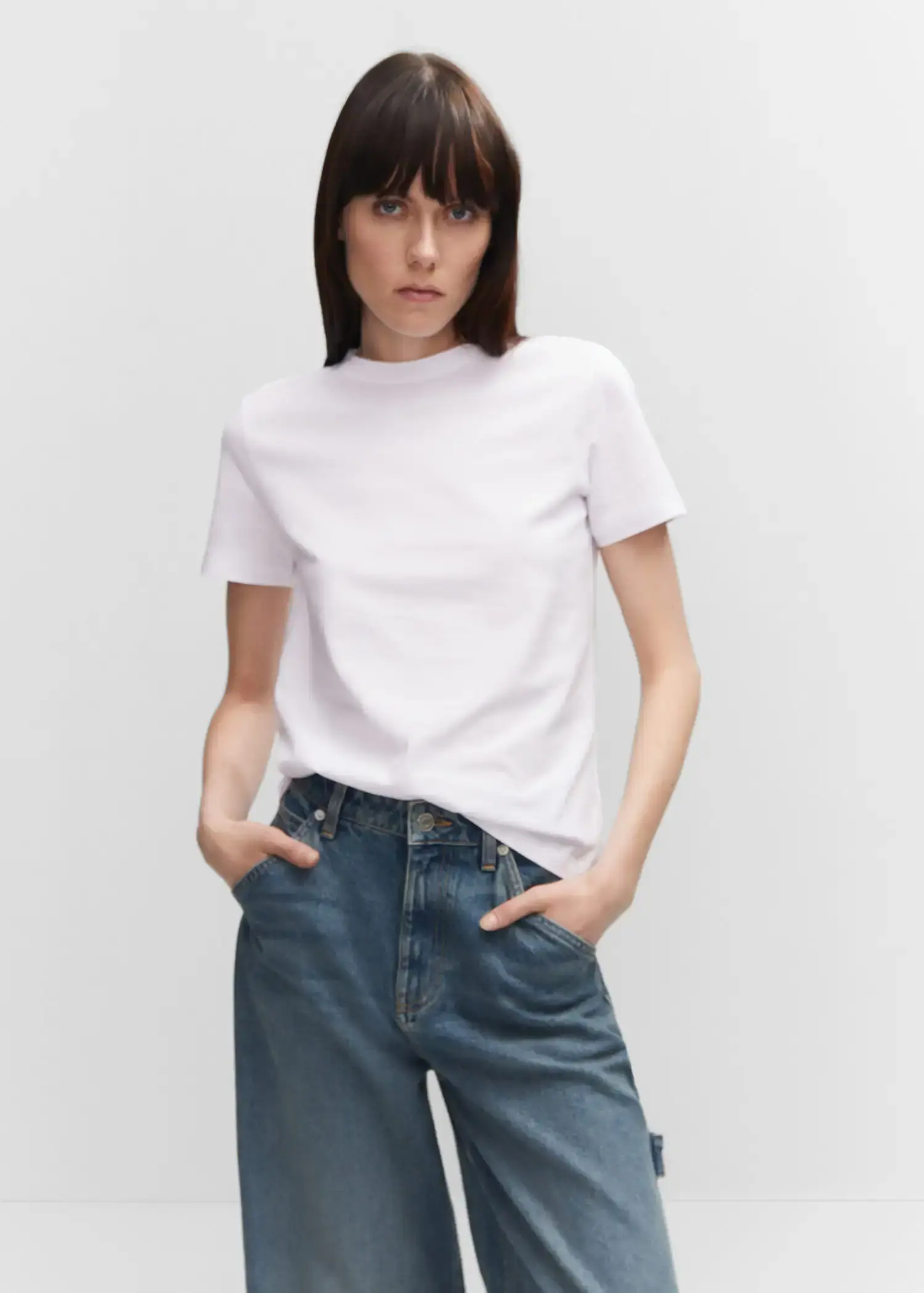 Mango 100% cotton T-shirt. a woman in white shirt and jeans posing for a picture. 