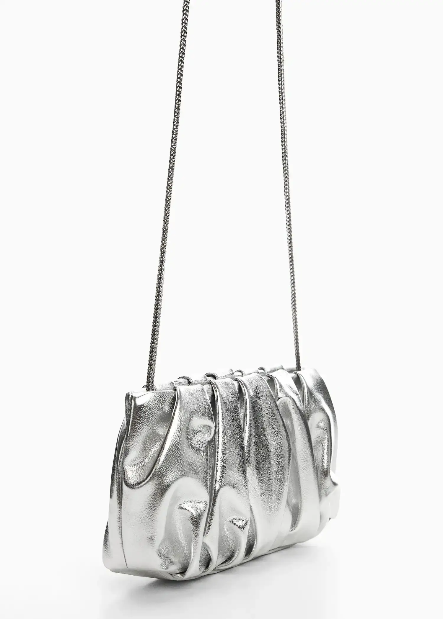 Mango Quilted chain bag. a silver purse is hanging on a white wall. 