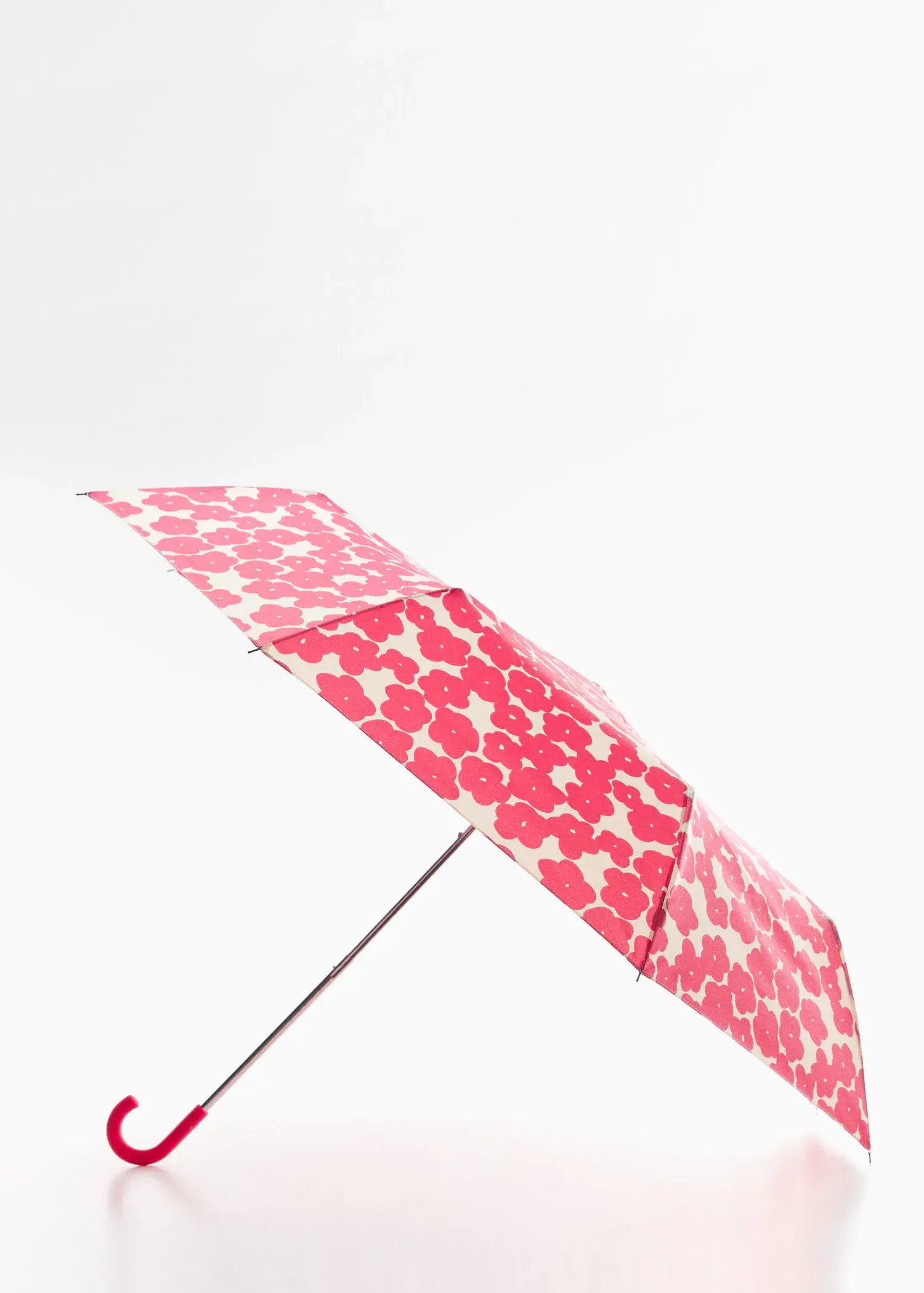 Mango Floral folding umbrella. an open umbrella with a red and white pattern. 