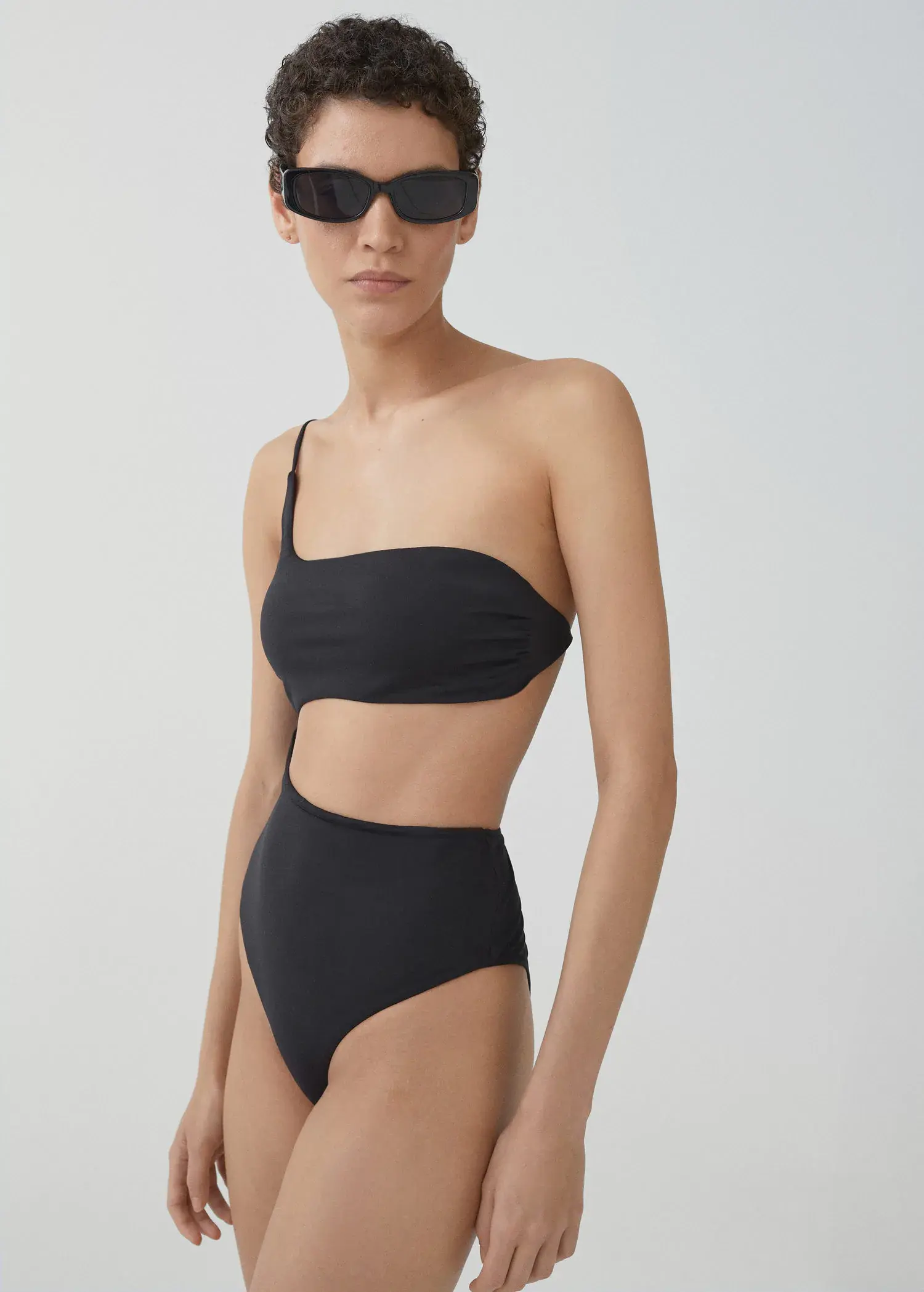 Mango Swimsuit with asymmetrical opening. 1