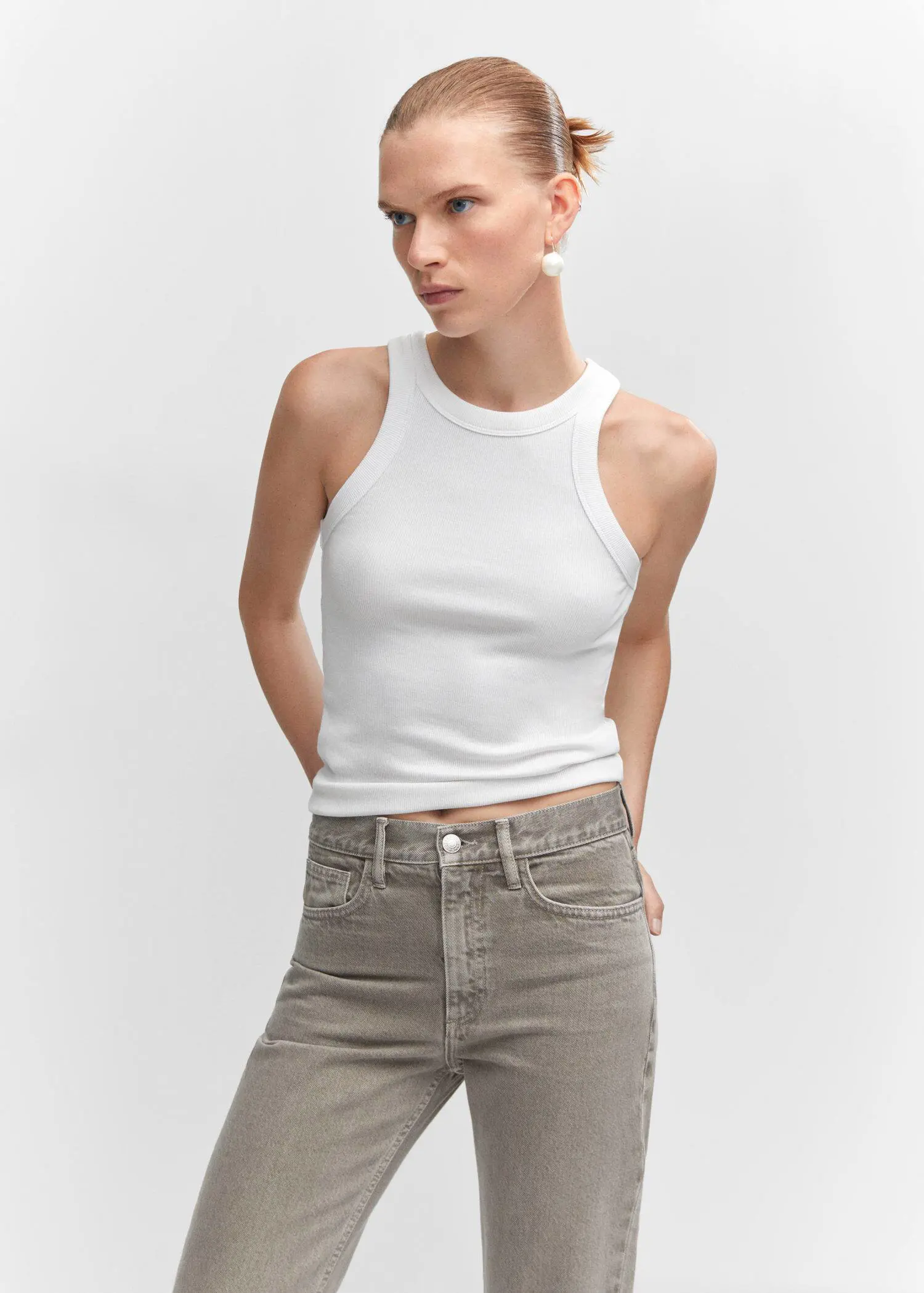 Mango Ribbed cotton-blend top. a woman in a white tank top is posing. 