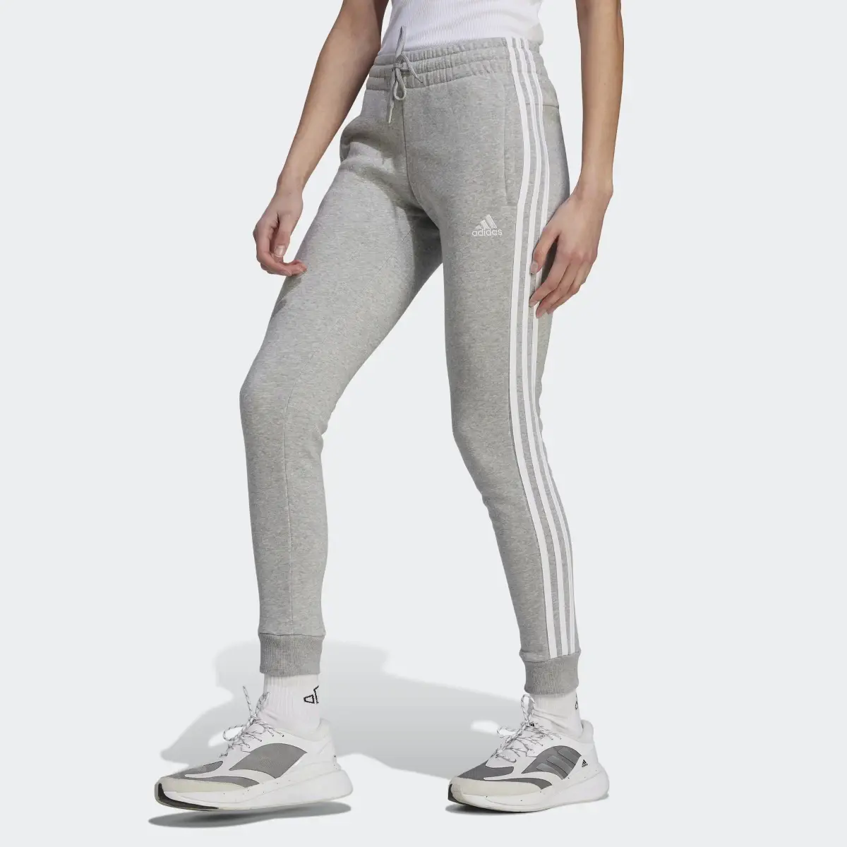 Adidas Essentials 3-Stripes Fleece Pants. 1