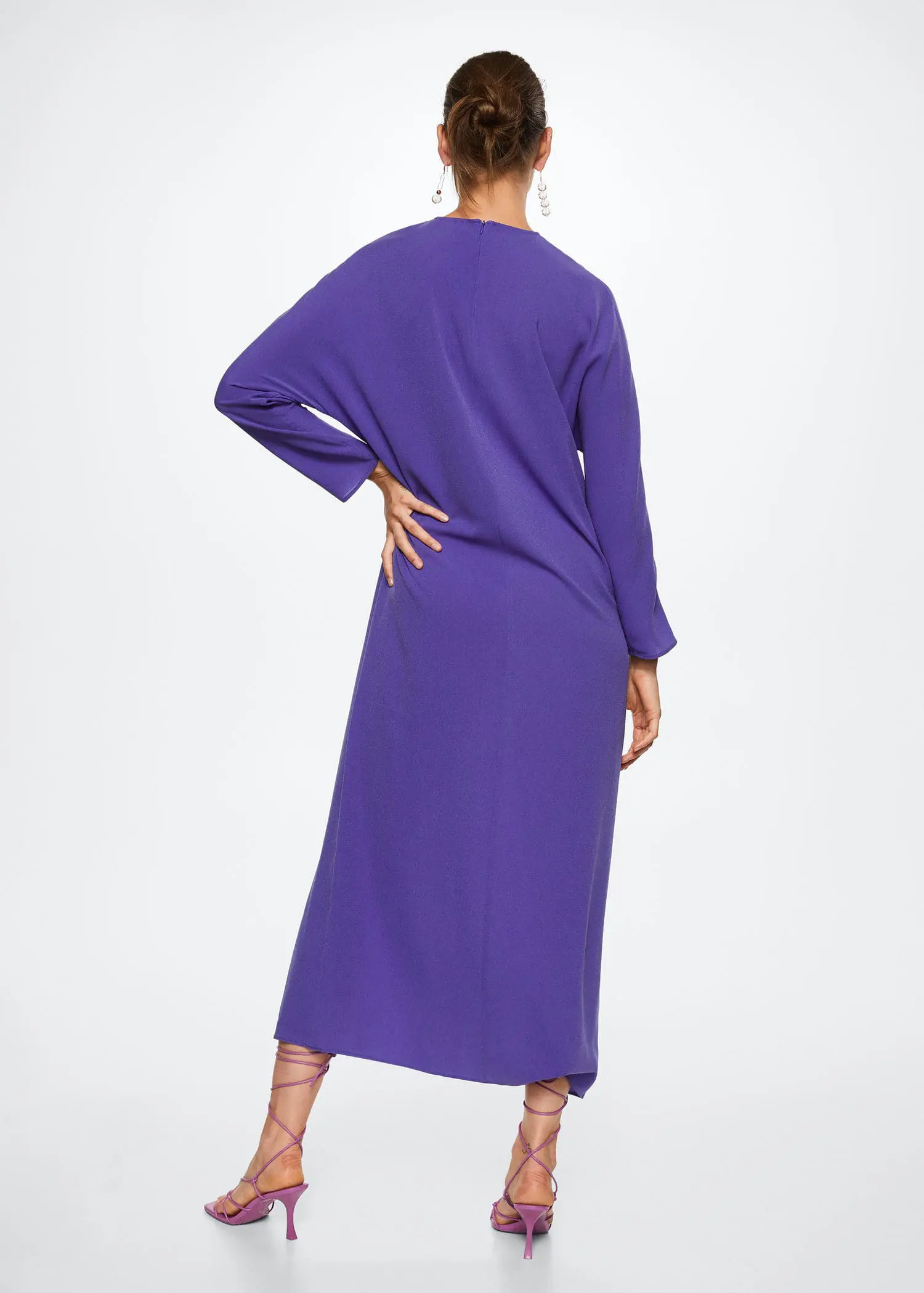 Mango Ruched detail dress. a woman wearing a long purple dress standing in front of a wall. 