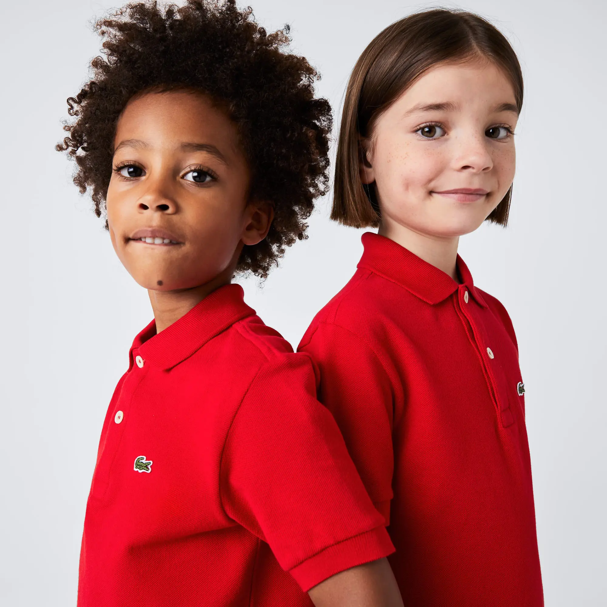 Lacoste Kids' Regular Fit Petit Piqué Polo. 1