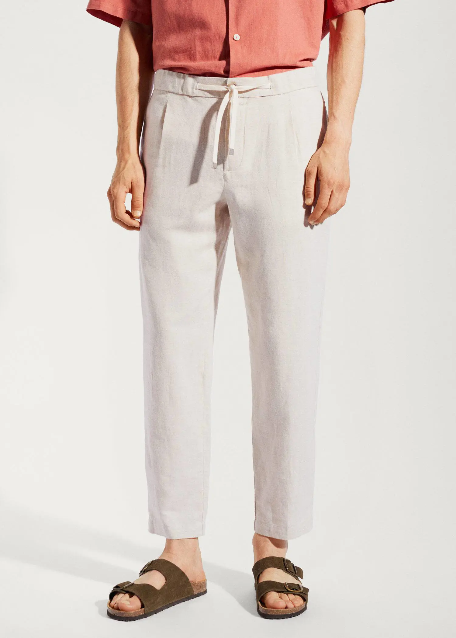 Mango Slim-fit pants with drawstring . a person standing wearing a pair of white pants. 