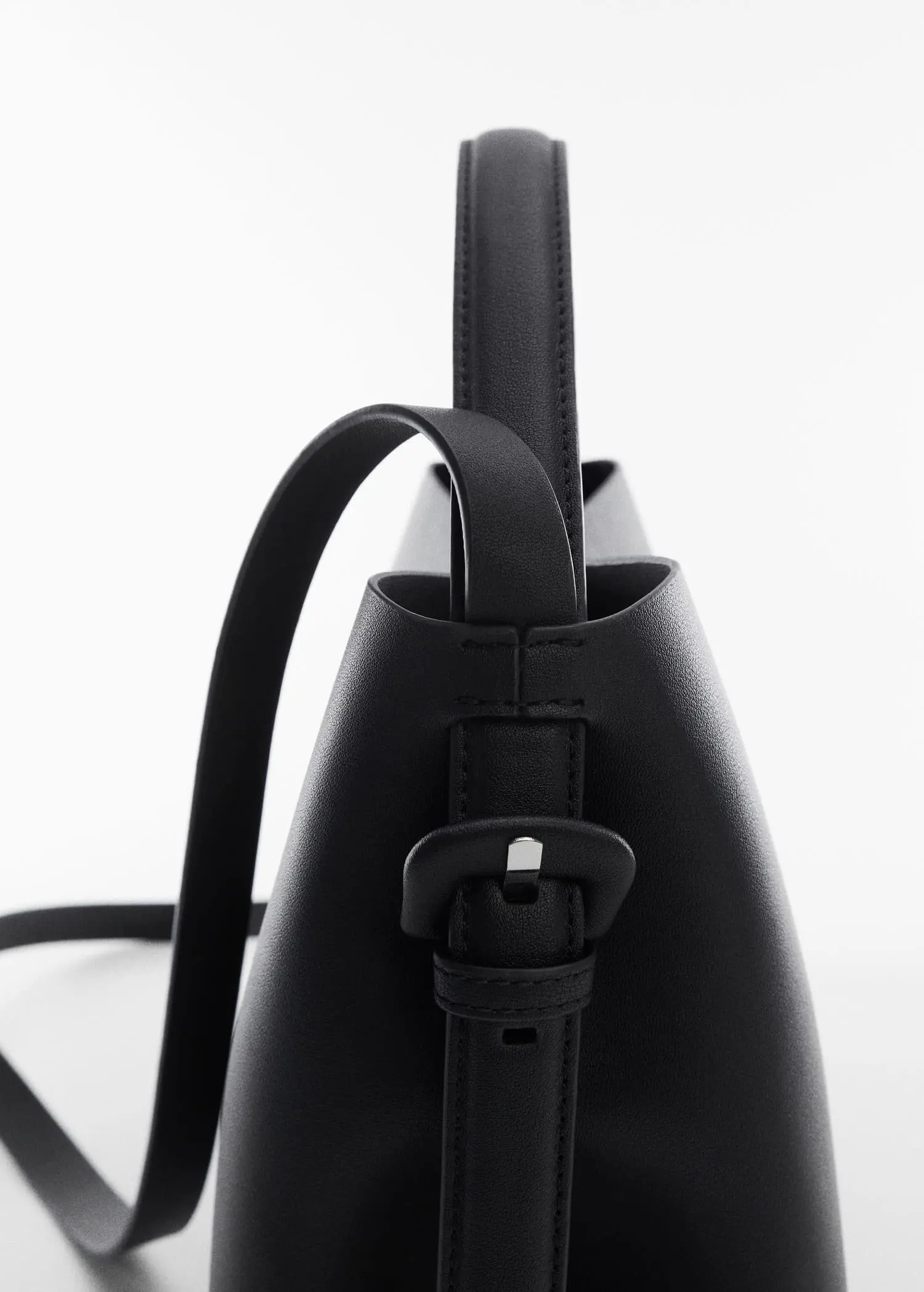 Mango Shopper bag with buckle. a close-up view of a black purse. 