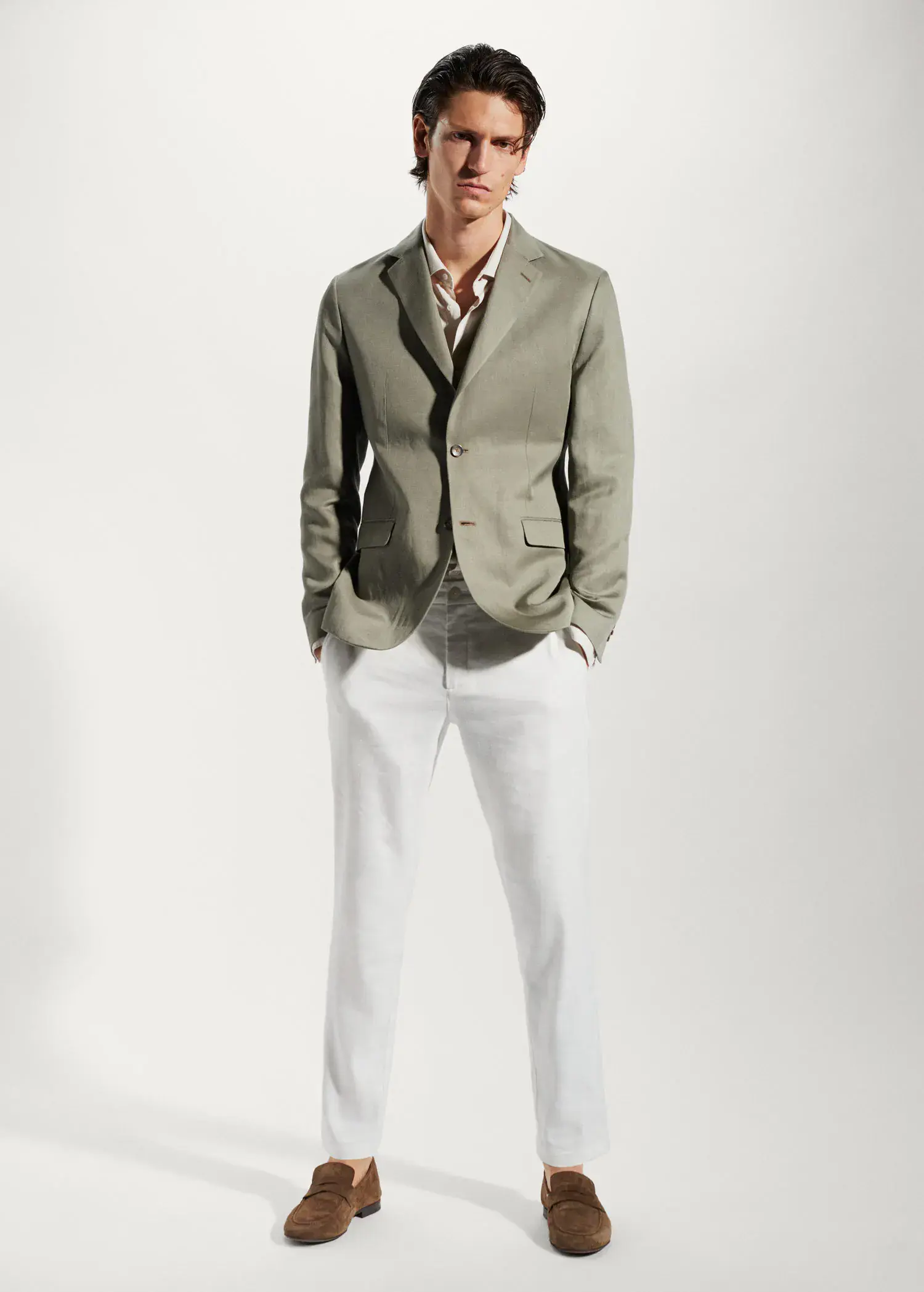 Mango Slim fit linen suit blazer. a man in a suit and tie standing with his hands in his pockets. 