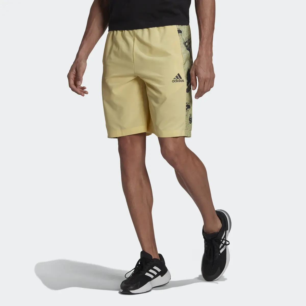 Adidas Essentials BrandLove Woven Shorts. 1