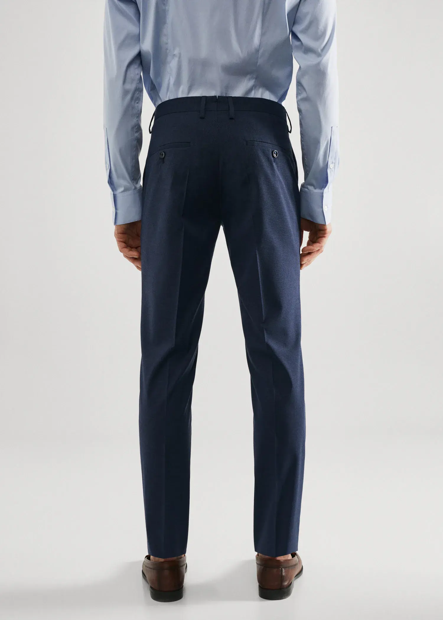Mango Super slim fit printed suit pants. a man wearing a suit standing in front of a white wall. 