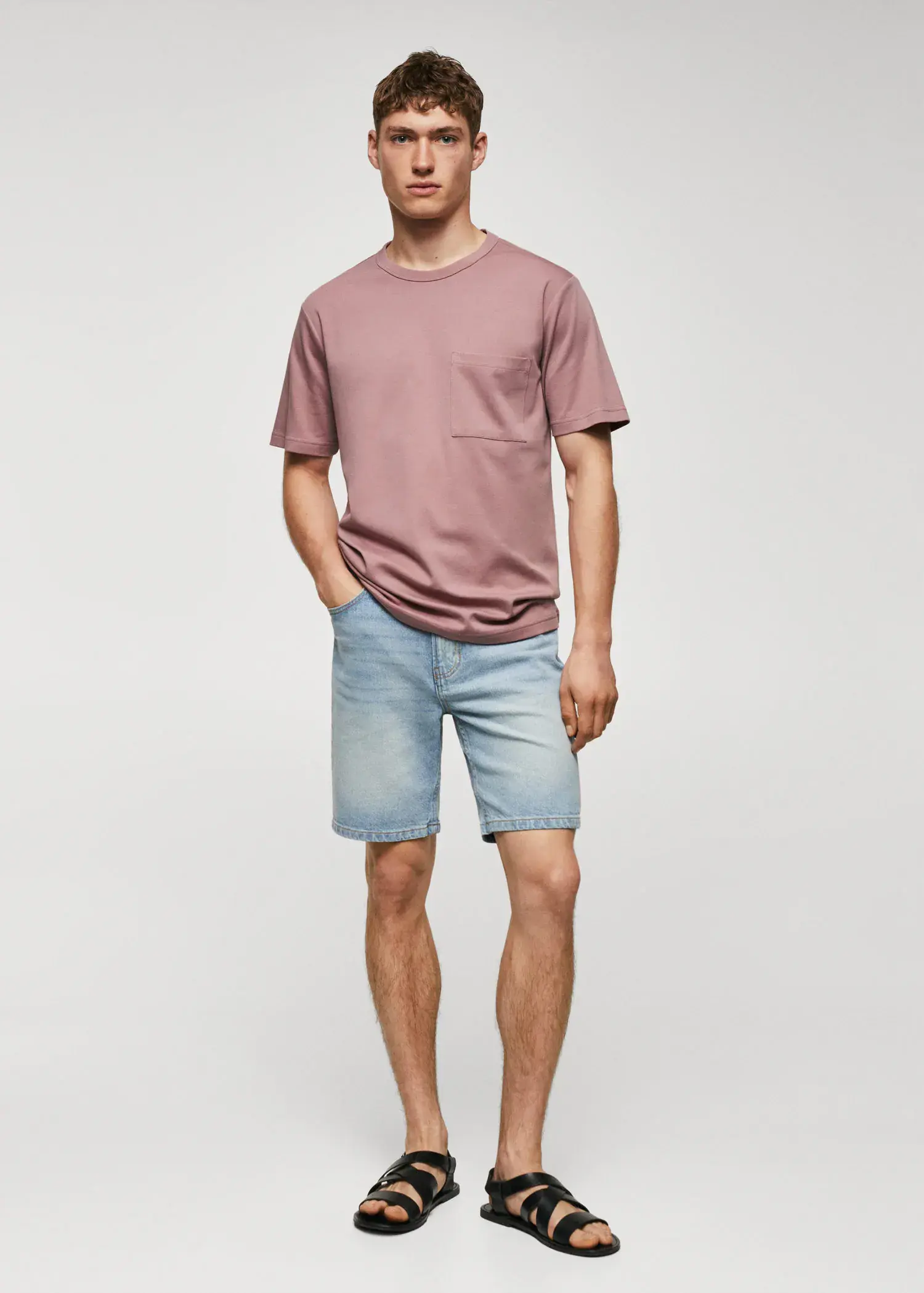 Mango 100% cotton t-shirt with pocket. a man wearing a pink shirt and blue shorts. 