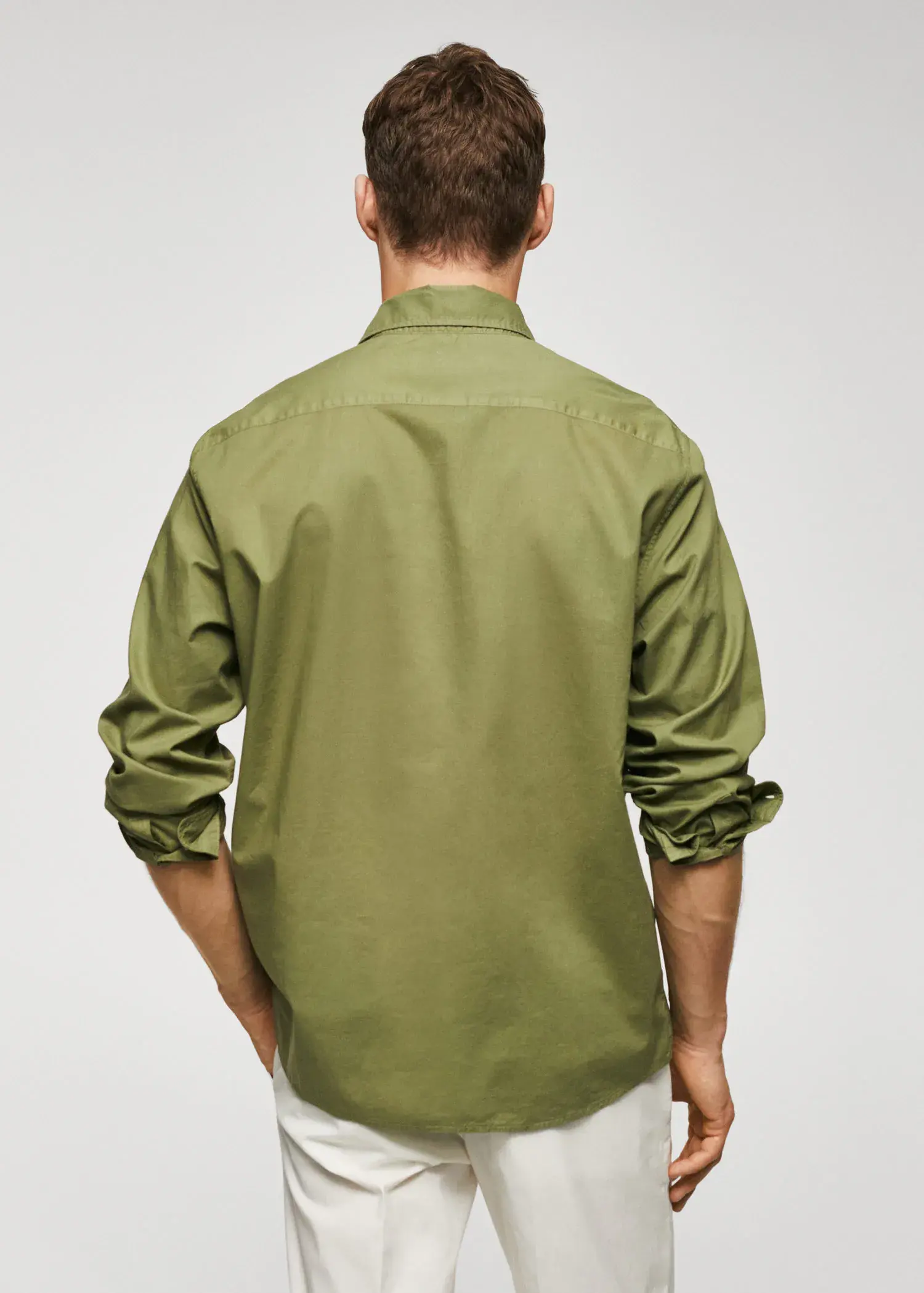 Mango Regular-fit cotton voile shirt. a man in a green shirt is standing up. 