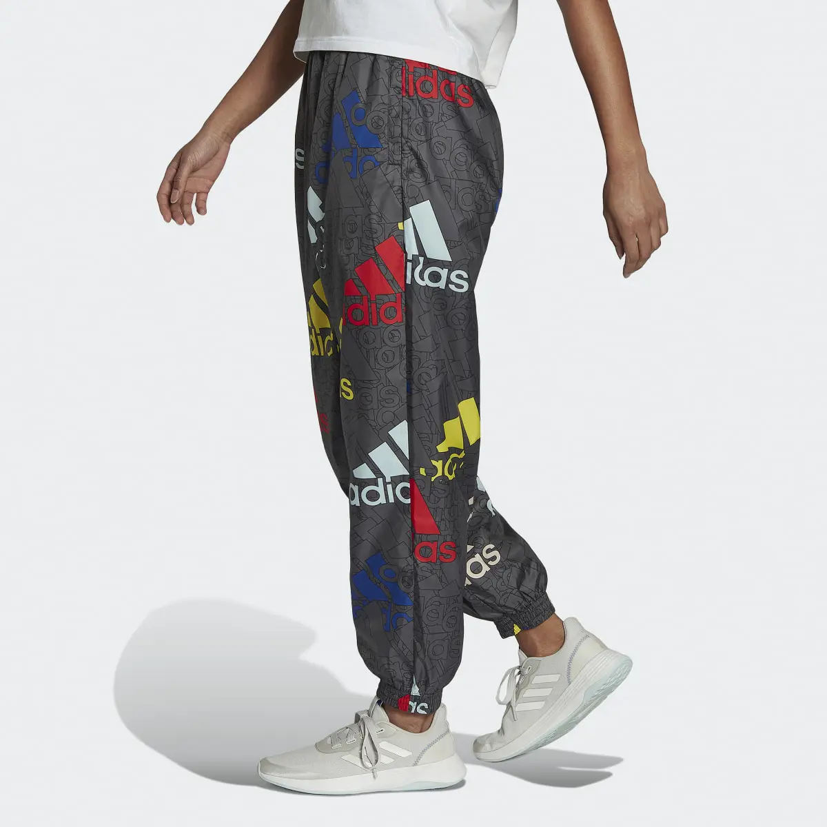 Adidas Essentials Multi-Colored Logo Loose Fit Woven Pants. 2