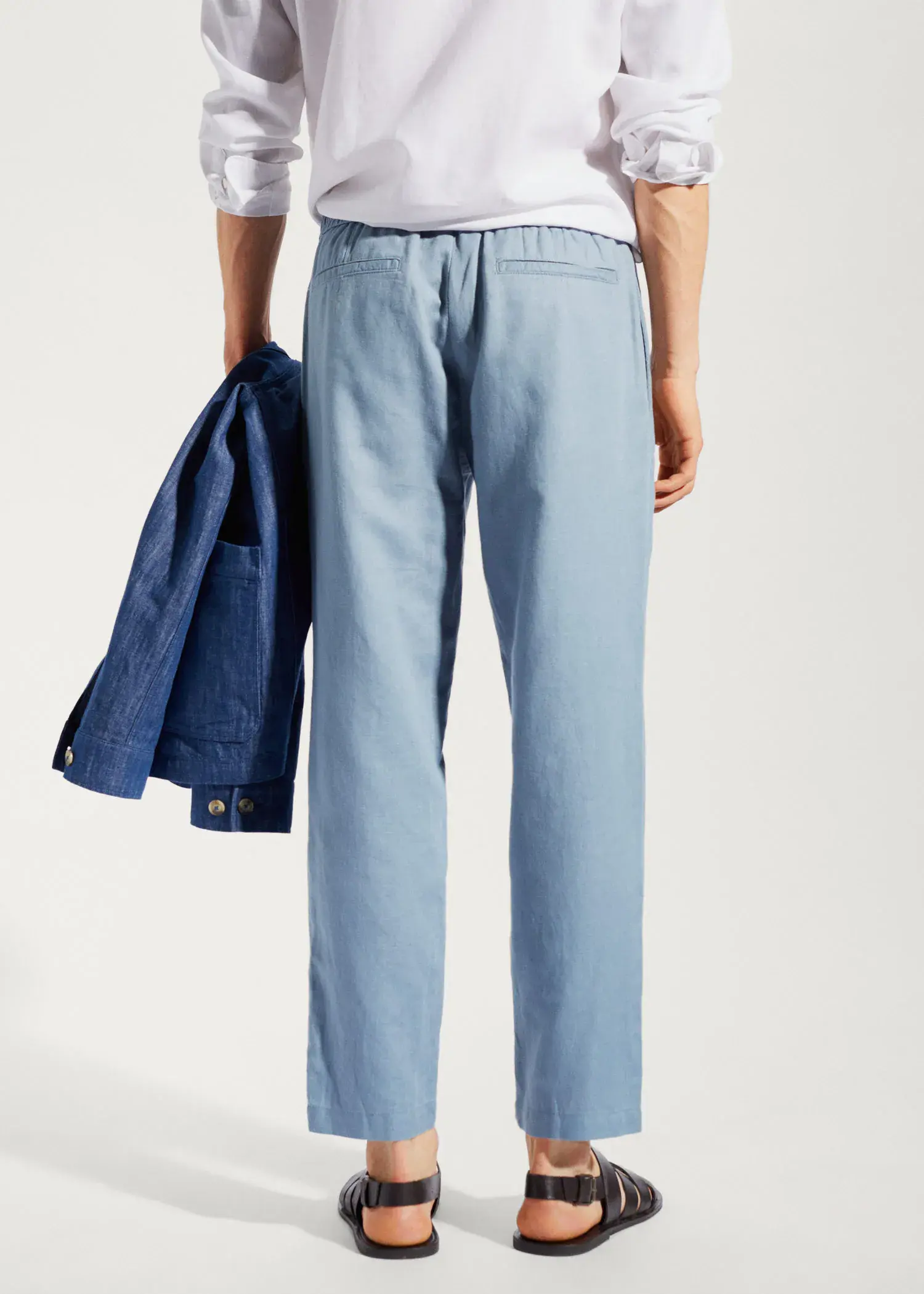 Mango Slim-fit trousers with drawstring . a person wearing a blue jacket and blue pants. 