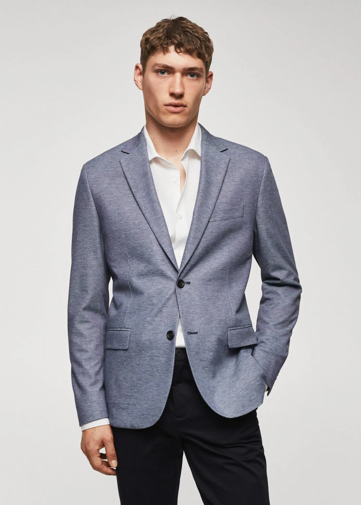Mango Slim fit microstructure blazer. a man wearing a suit and a white shirt. 