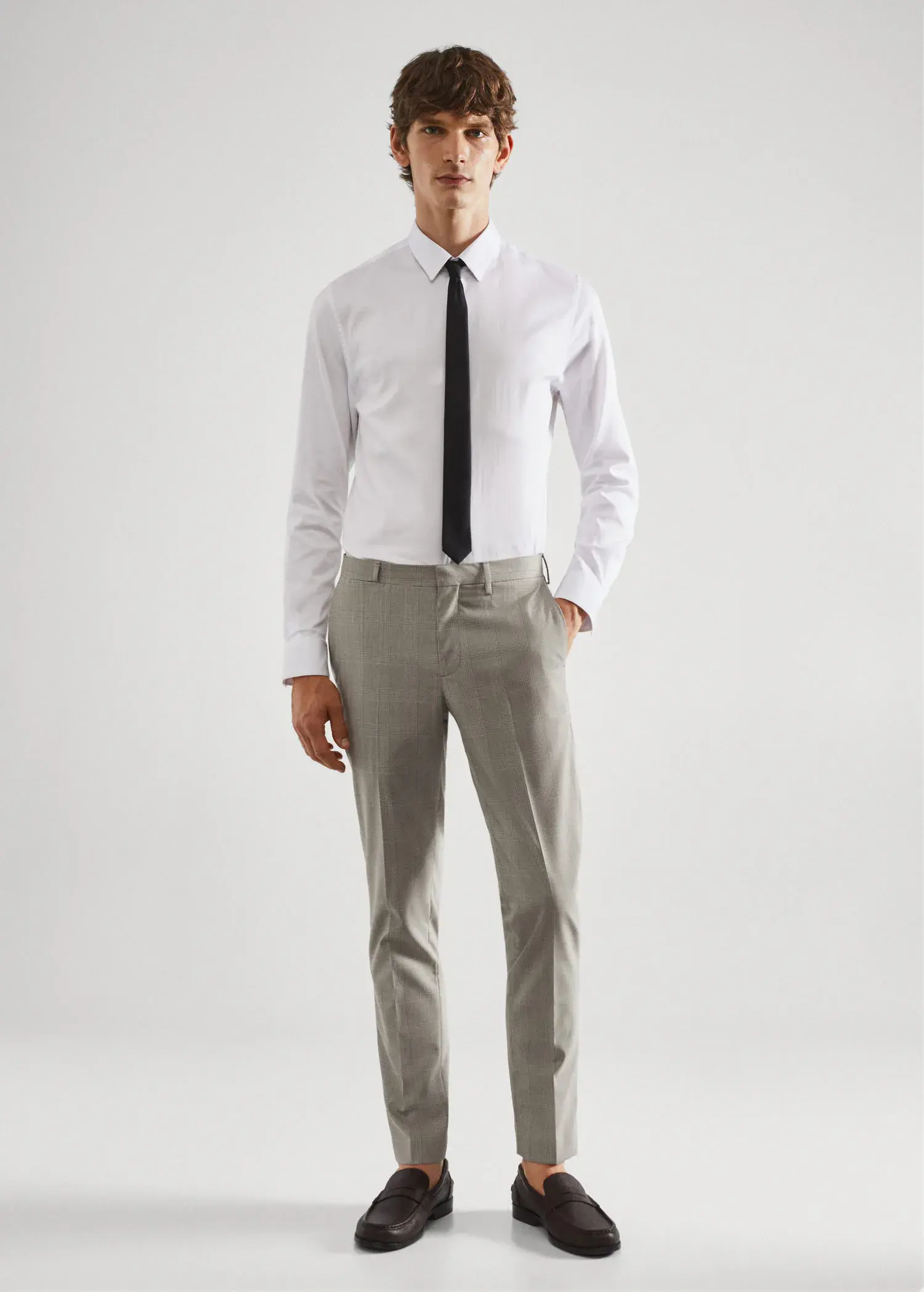 Mango Super slim-fit printed suit trousers. a man in a white dress shirt and black tie. 