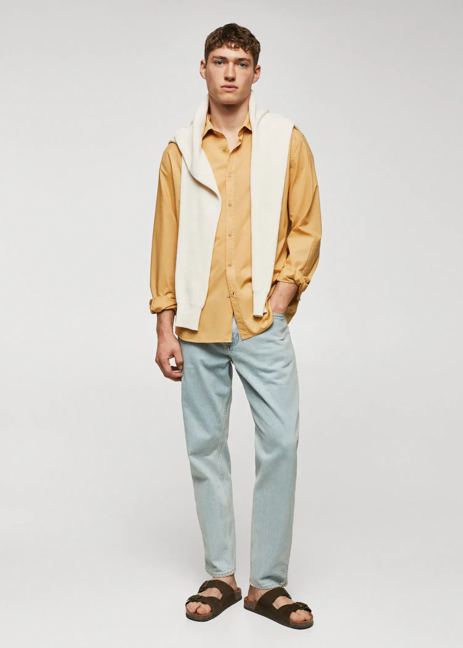 Mango Regular-fit cotton voile shirt. a man in a yellow shirt and a white vest. 