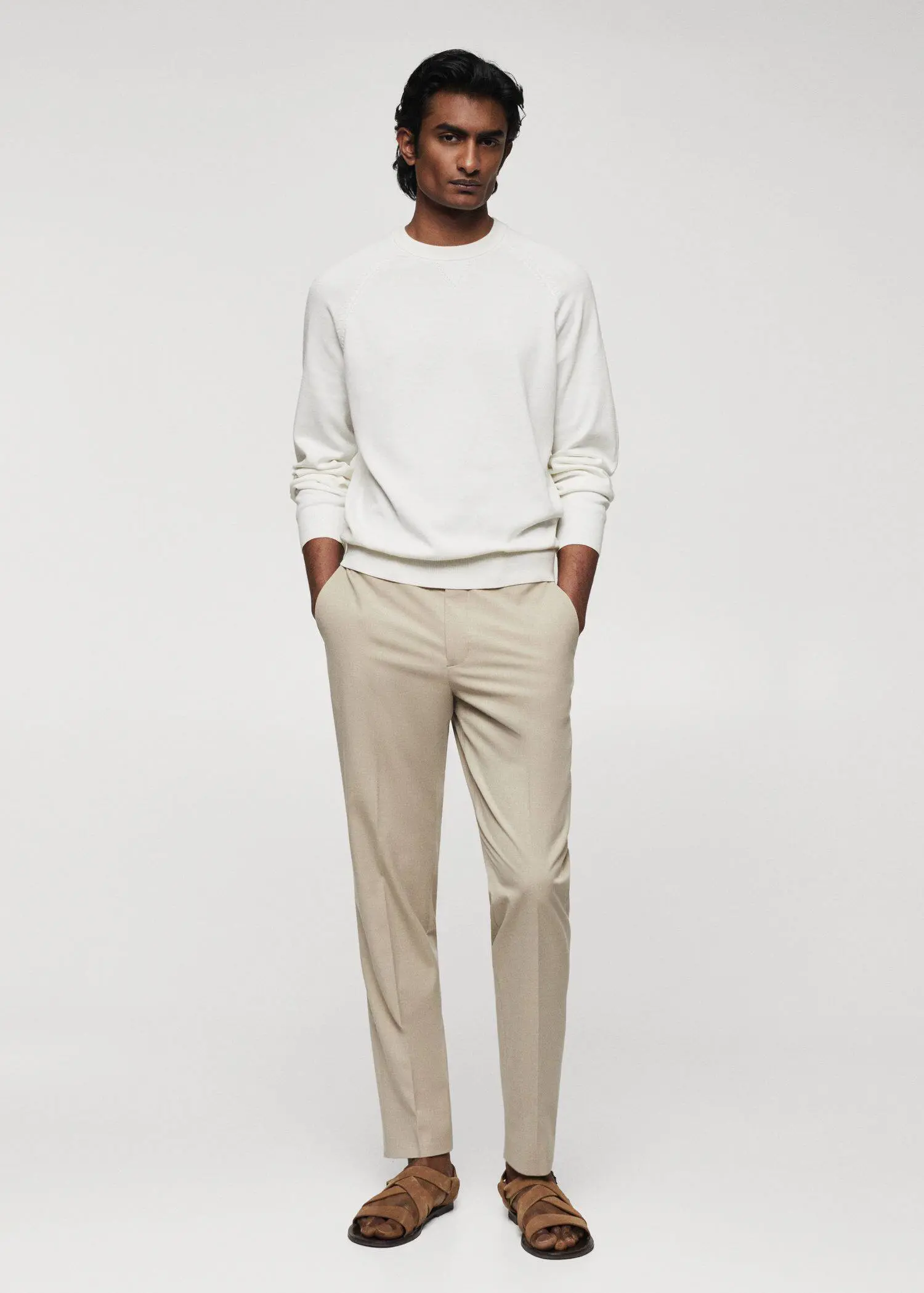 Mango Fine-knit cotton sweater. a man standing in front of a white wall. 
