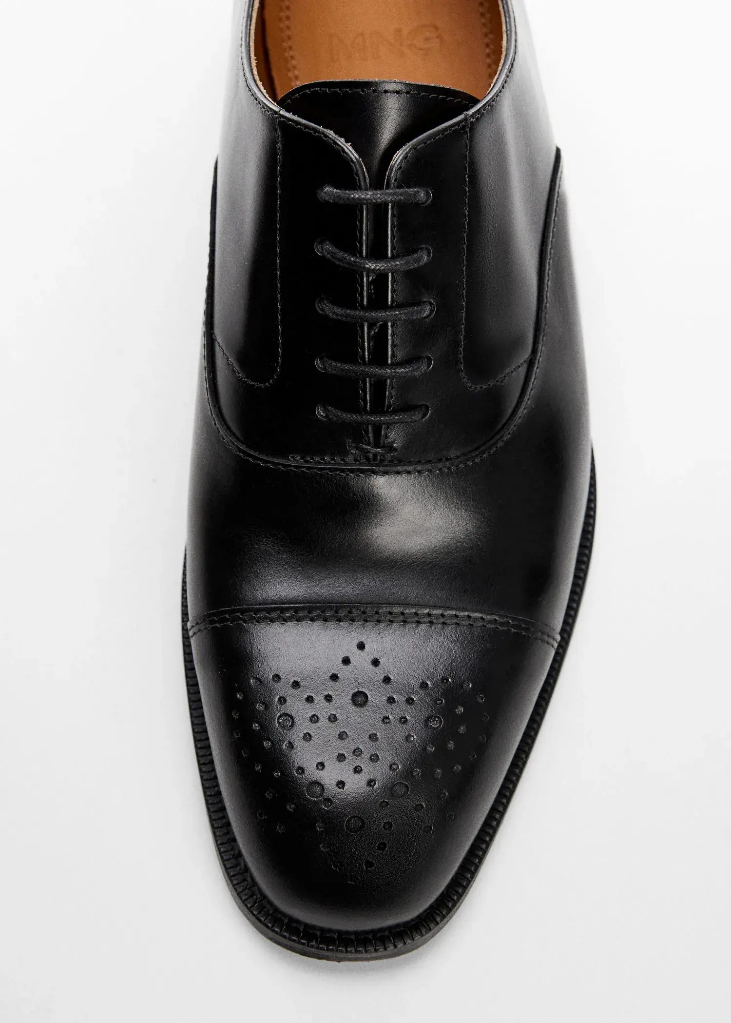 Mango Laser-cut leather blucher shoes. a pair of black shoes on a white surface. 