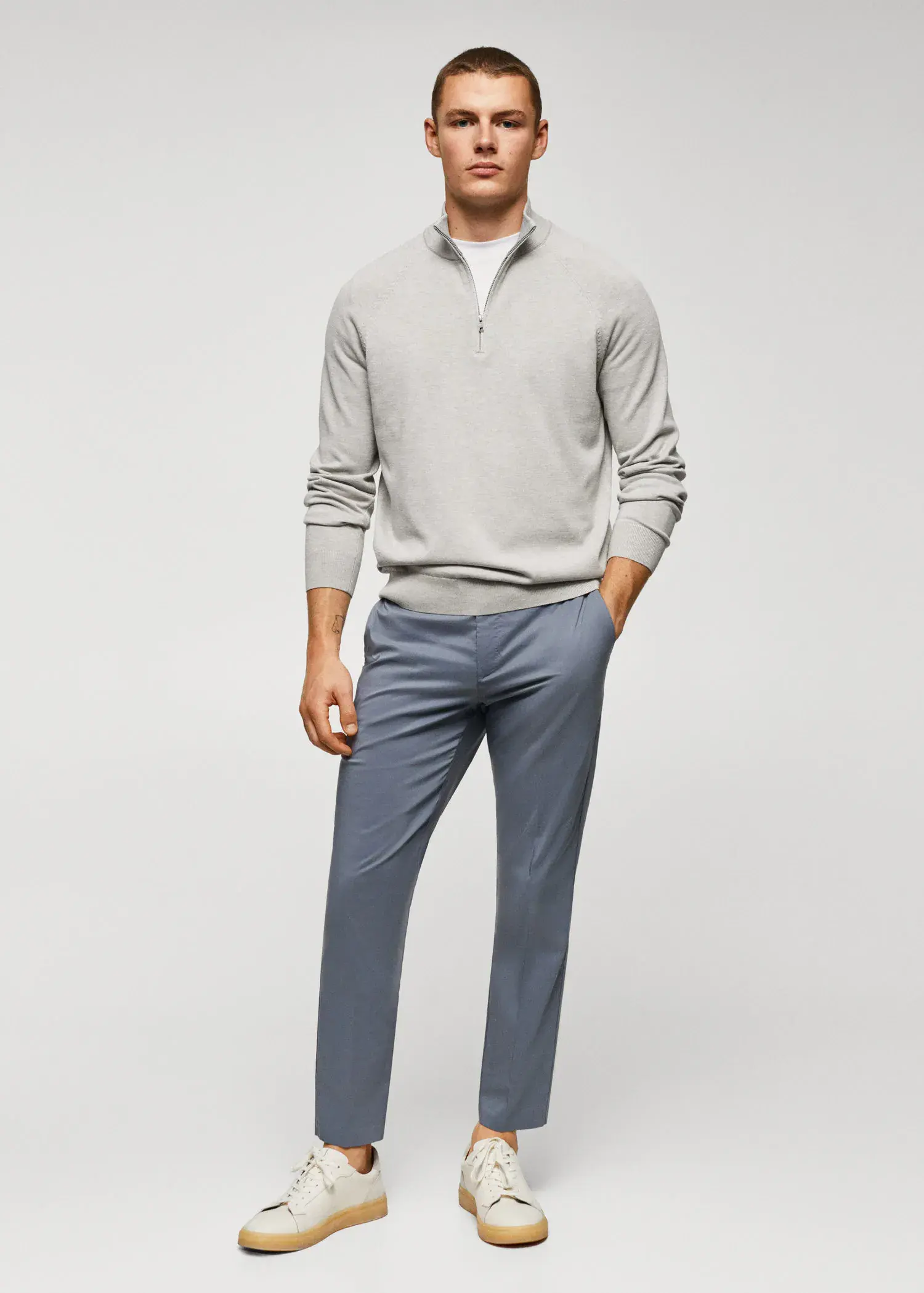 Mango Cotton sweater with neck zipper. a man wearing a gray sweater and blue pants. 