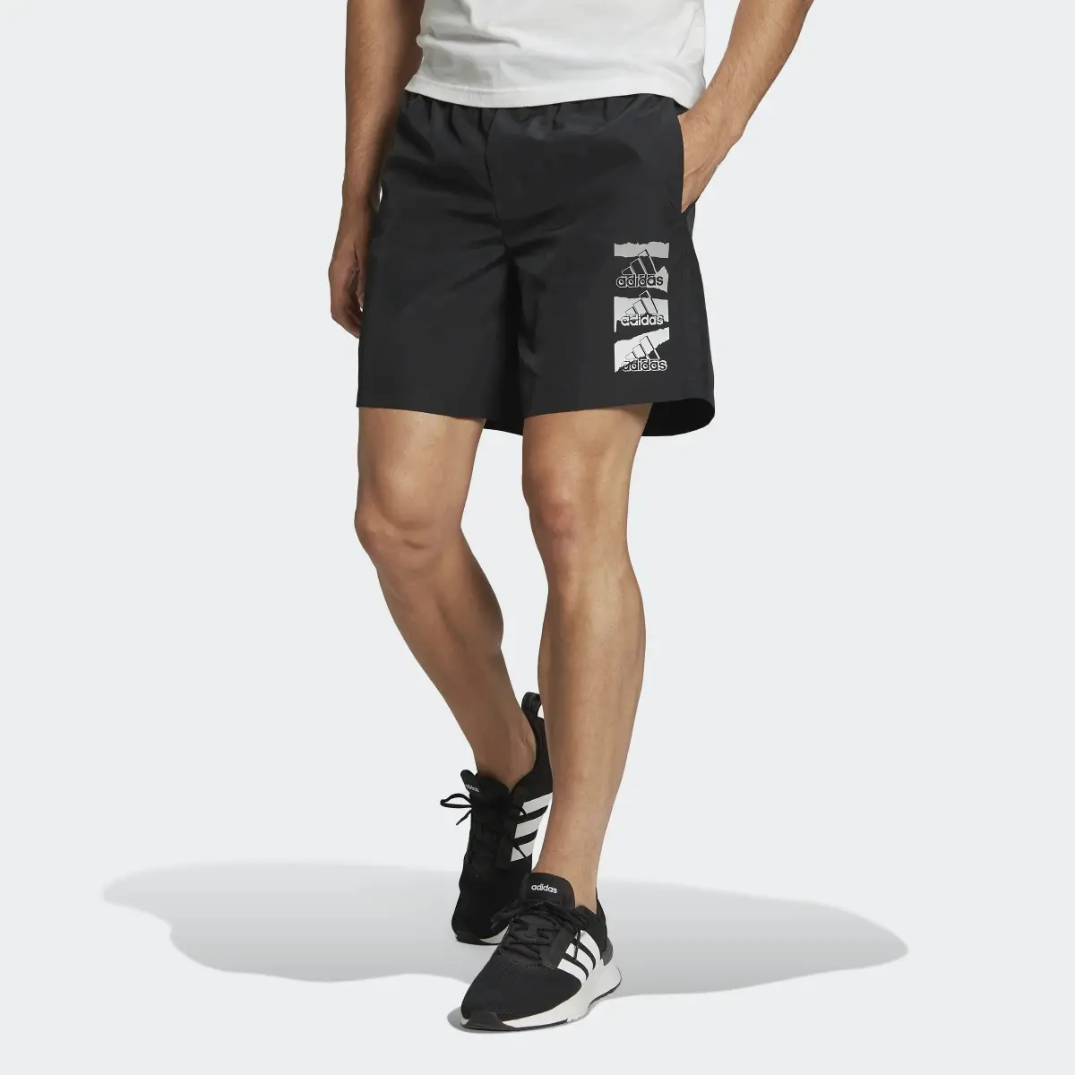 Adidas Essentials BrandLove Chelsea Woven Shorts. 1