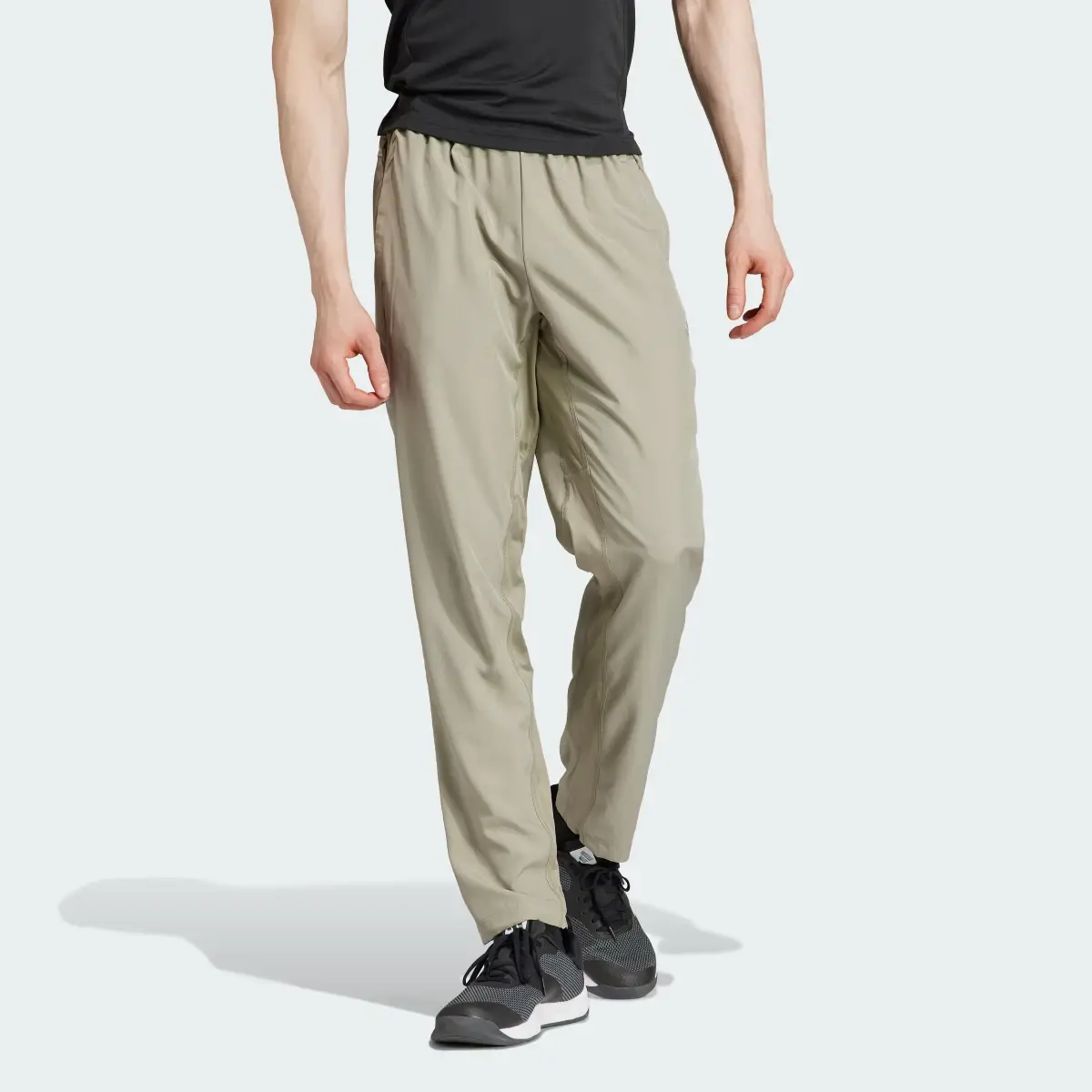 Adidas Train Essentials Seasonal Woven Training Pants. 1