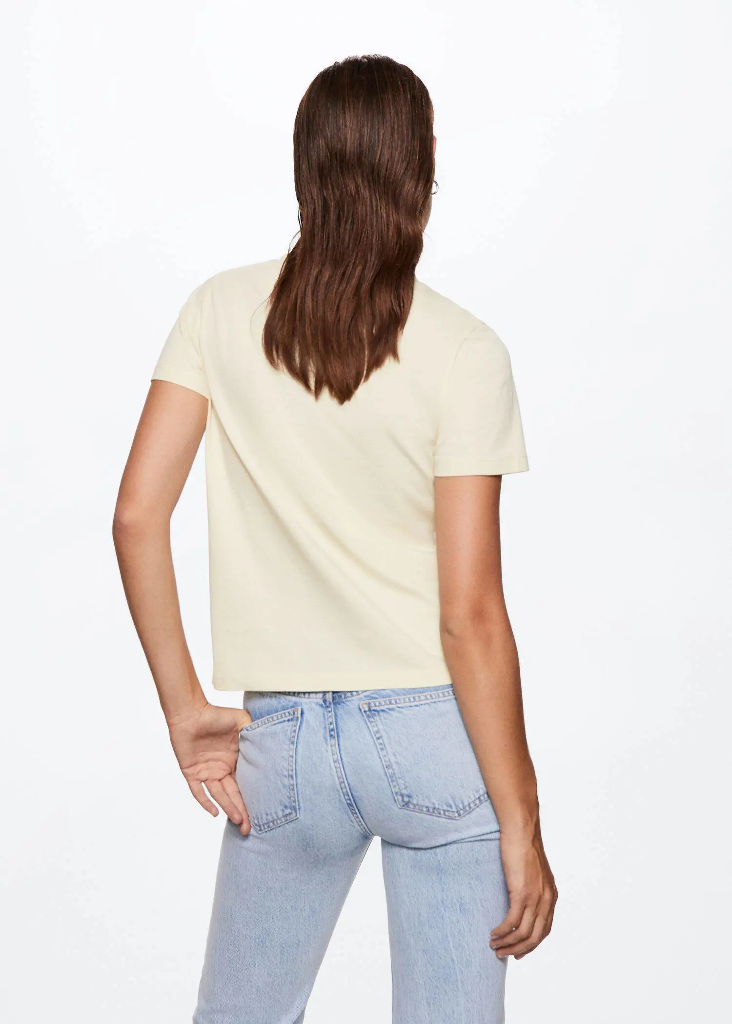 Mango Printed message T-shirt. a woman in a white shirt and blue jeans. 