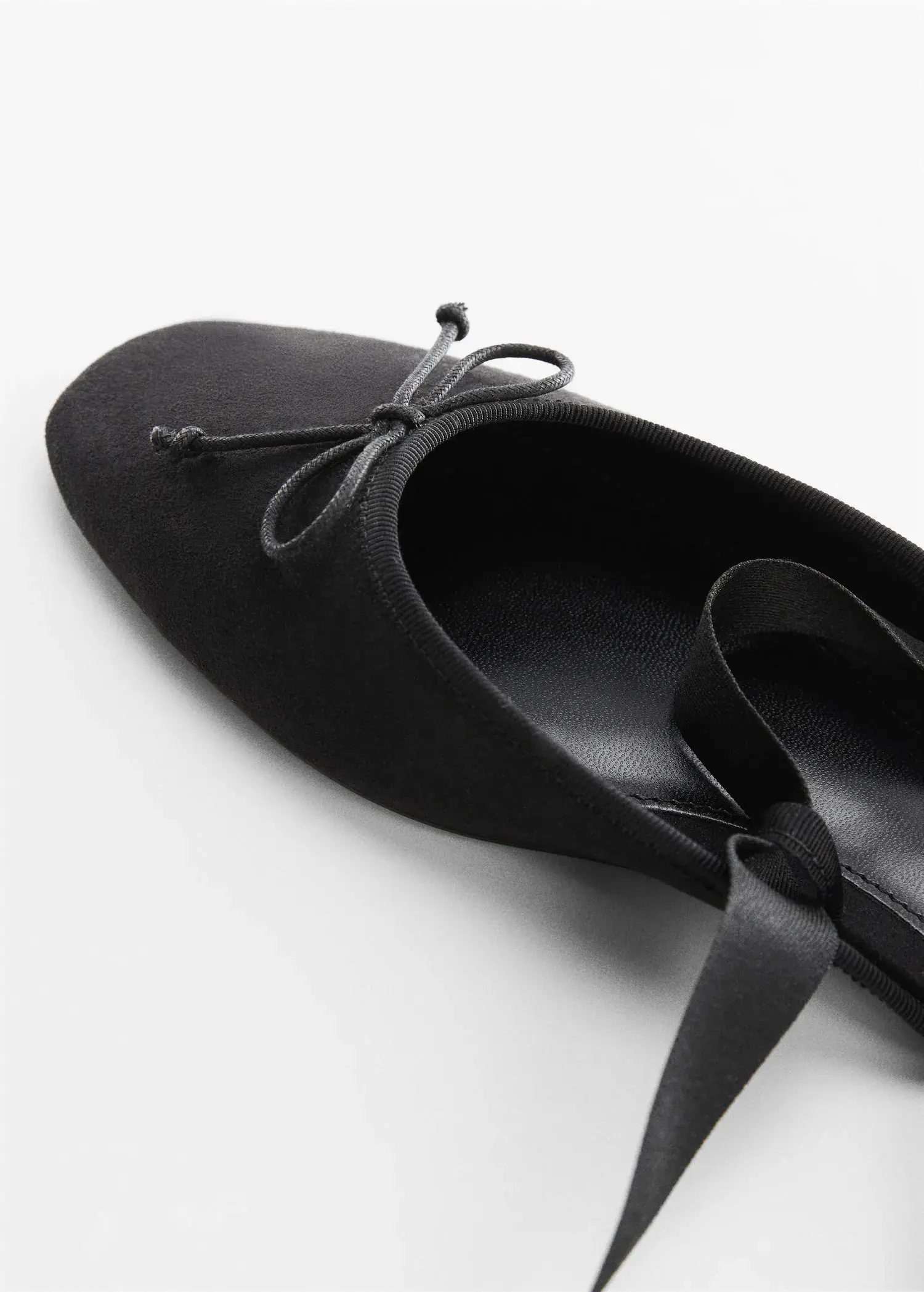 Mango Lace-up ballerinas. a pair of black shoes on a white surface. 