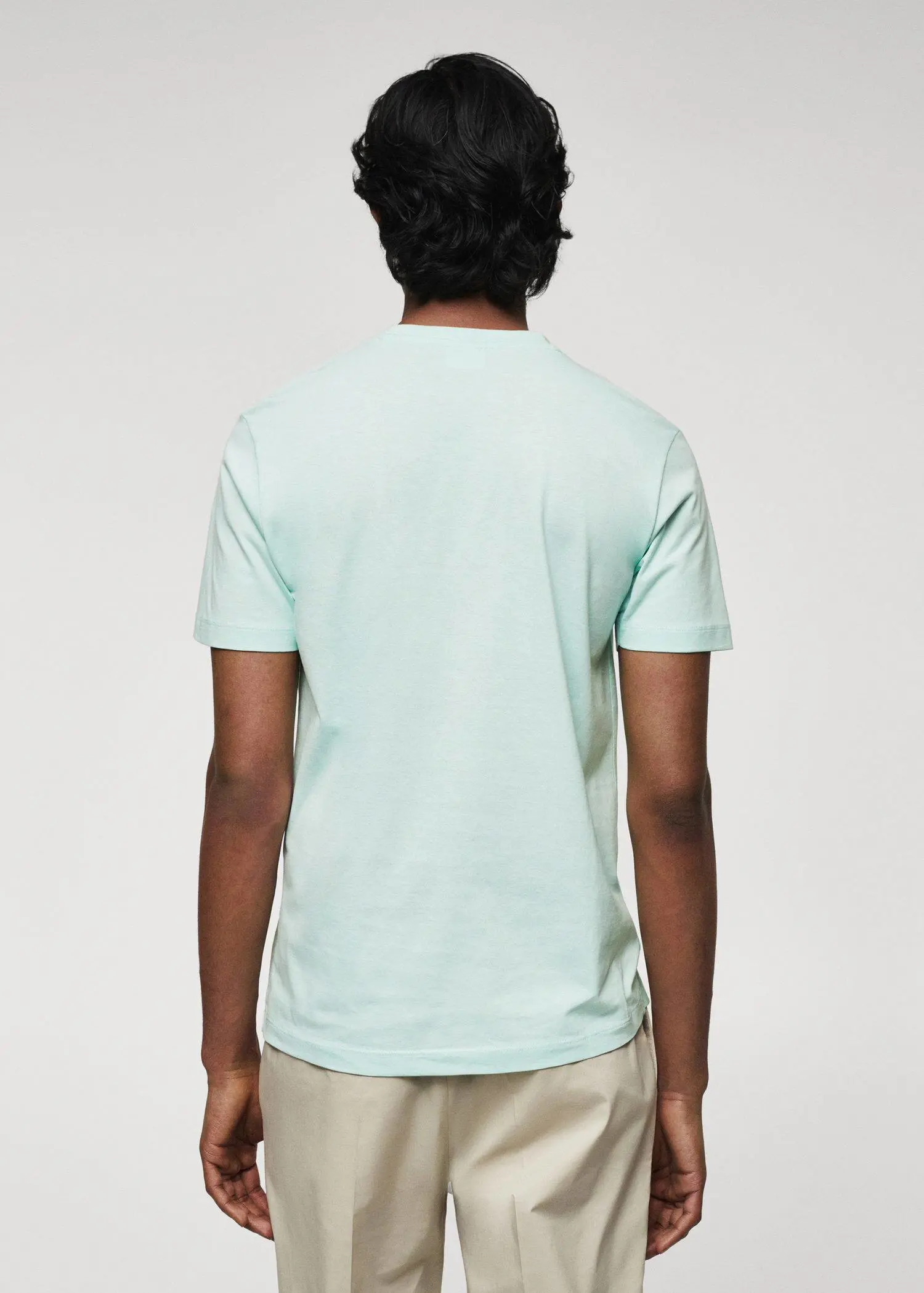Mango 100% cotton t-shirt . a person wearing a light blue t-shirt. 