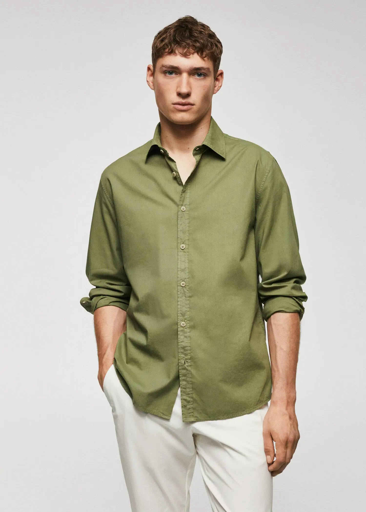 Mango Regular-fit cotton voile shirt. a man wearing a green shirt and white pants. 