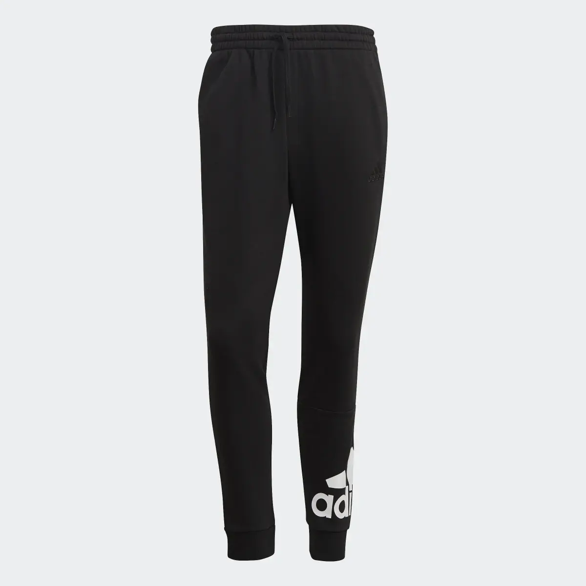 Adidas Essentials French Terry Tapered Cuff Logo Pants. 1