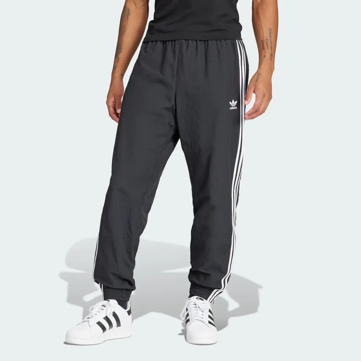 Adidas Adicolor Woven Firebird Track Pants. 1