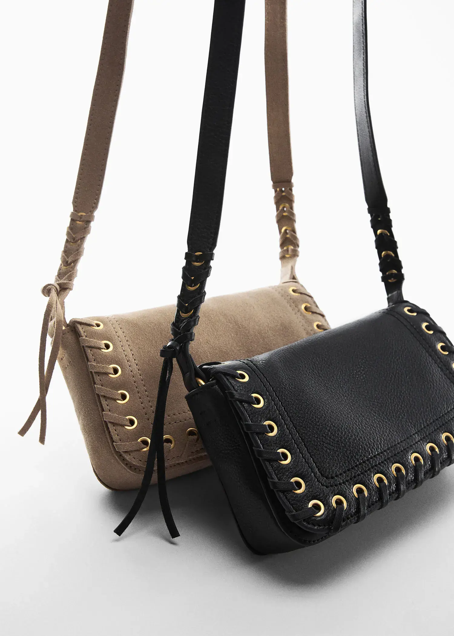Mango Stud leather bag. a pair of black and tan bags sitting next to each other. 