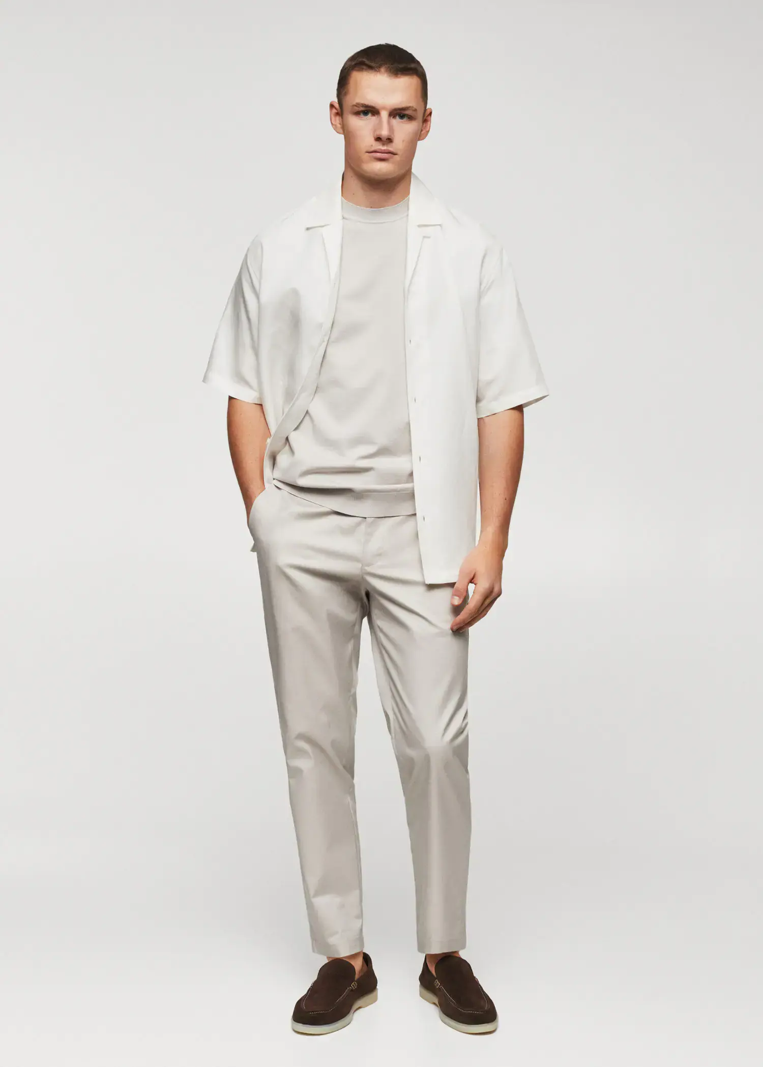Mango Fine-knit T-shirt. a man in a white shirt and jacket 