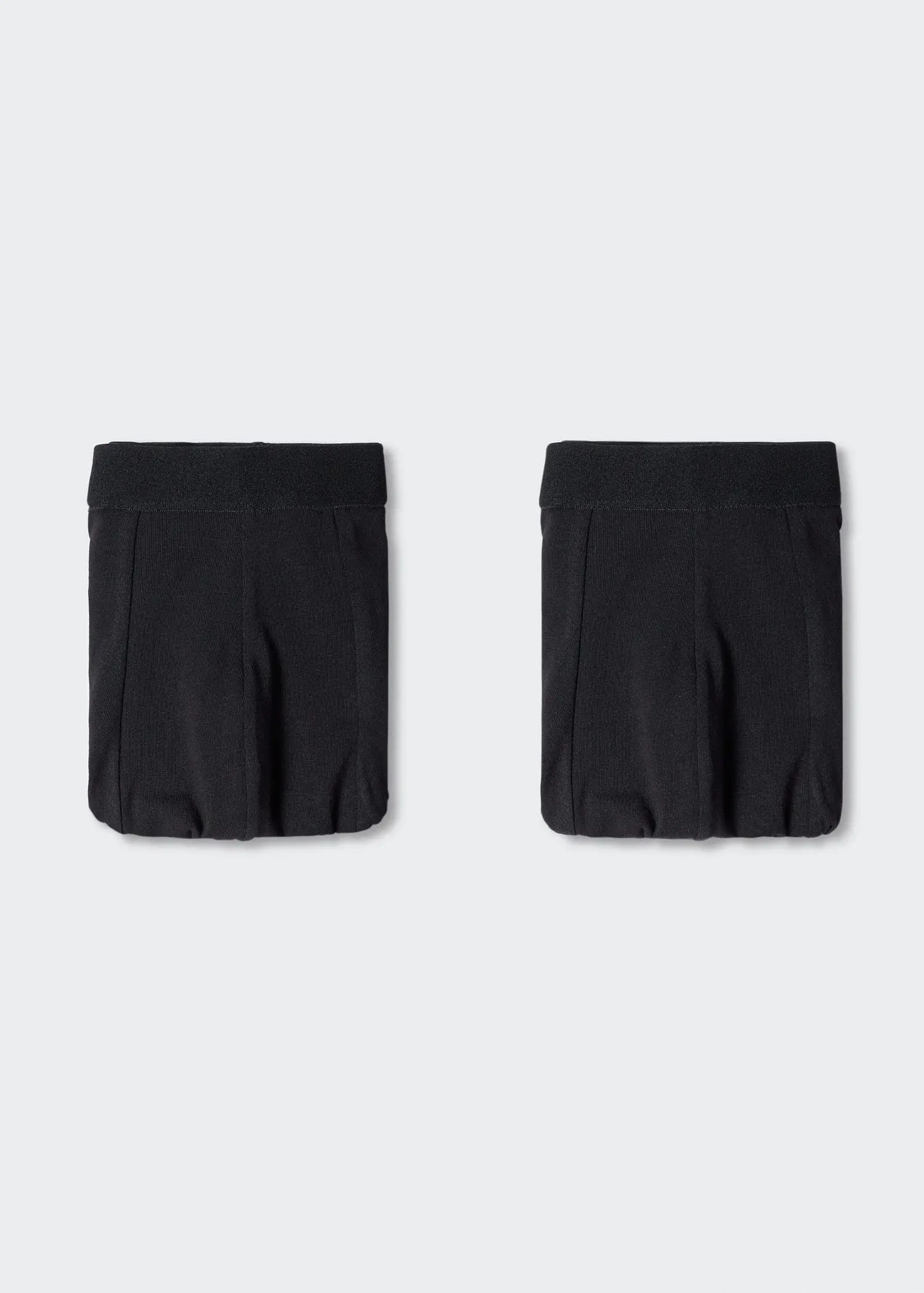 Mango 2 pack basic briefs . a pair of black shorts sitting on top of a white wall. 
